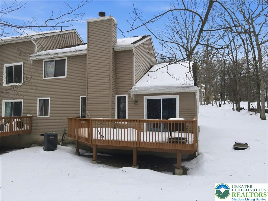 3301 Windermere Drive Bushkill, PA 18324 - Photo 41 of 71 a view of a house with a wooden deck and a roof deck