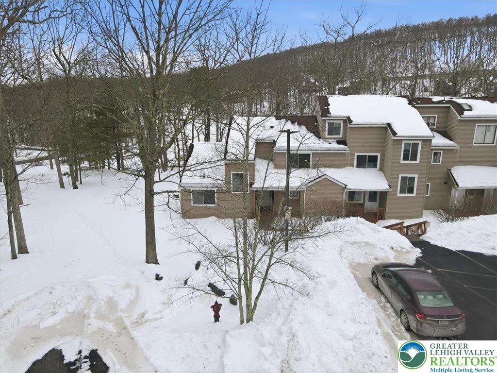 3301 Windermere Drive Bushkill, PA 18324 - Photo 59 of 71 a view of a terrace with chairs and a fire pit