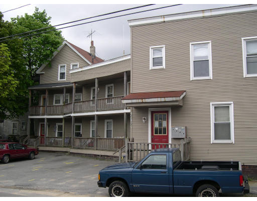 2-12 Chace Street Clinton, MA 01510 - Photo 1 of 1 a car parked in front of a house