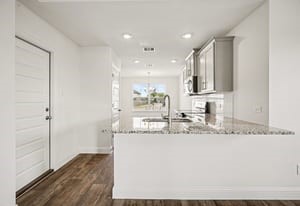 19 Greenbriar Loop Angleton, TX 77515 - Photo 14 of 19 Bright and airy kitchen with abundant natural light, creating an inviting space for cooking and gathering.