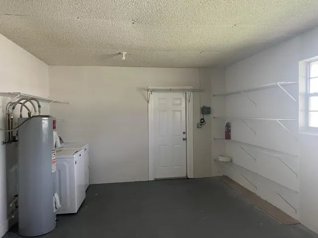a view of utility room and empty room