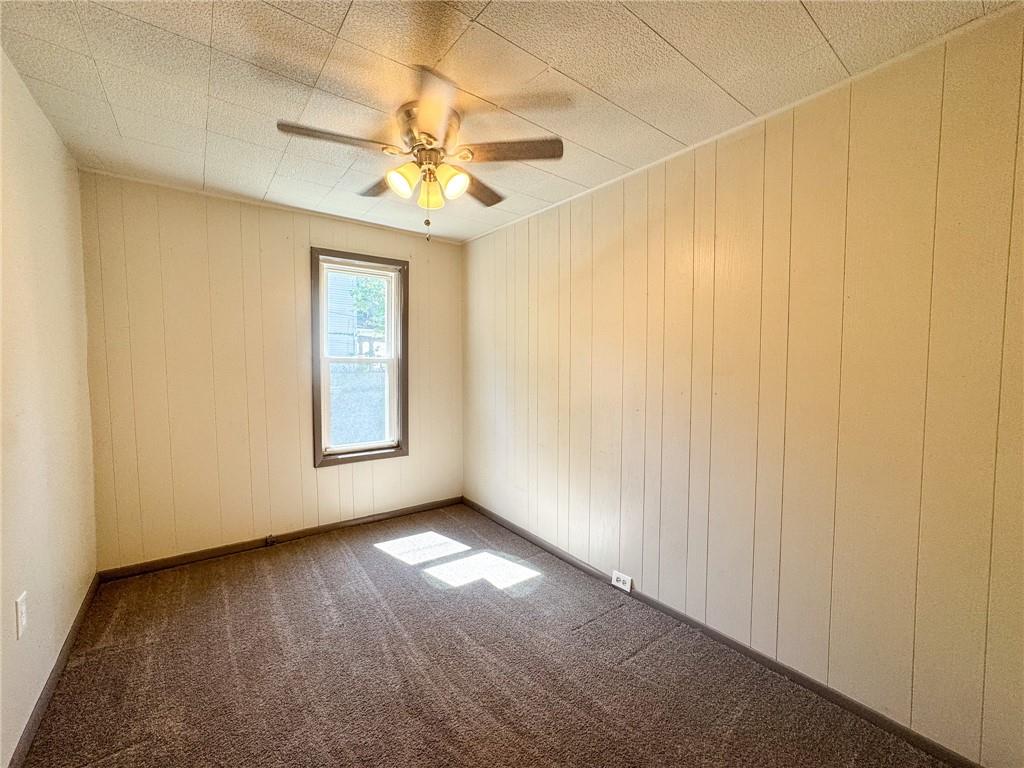 121 Heim Avenue Butler, PA 16001 - Photo 11 of 16 an empty room with windows and fan