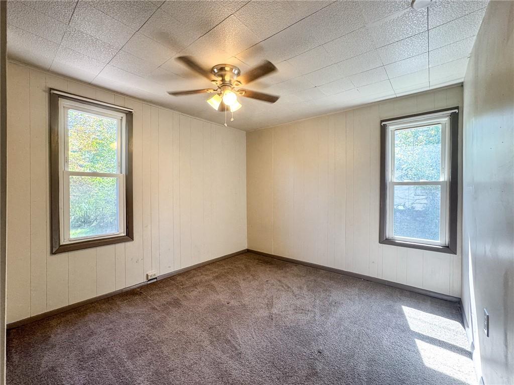 121 Heim Avenue Butler, PA 16001 - Photo 13 of 16 an empty room with windows and fan
