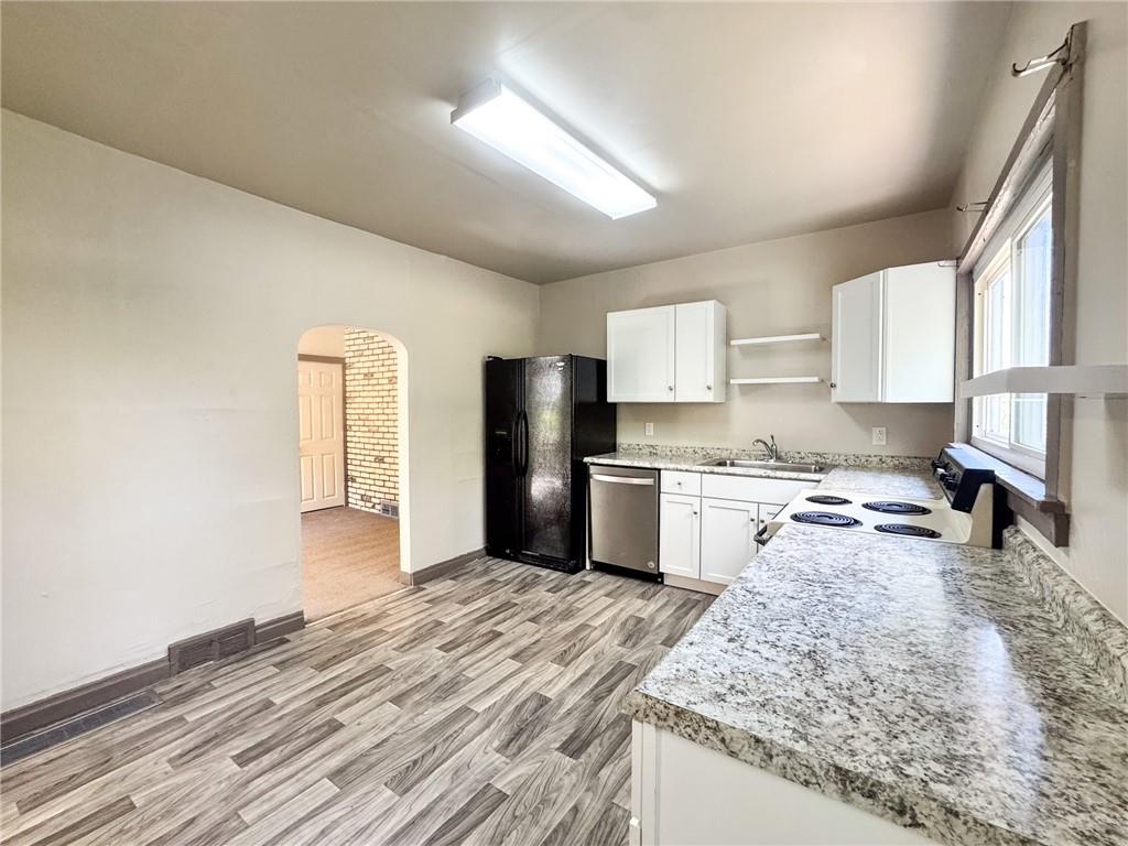 121 Heim Avenue Butler, PA 16001 - Photo 7 of 16 a kitchen with stainless steel appliances granite countertop a sink refrigerator and cabinets