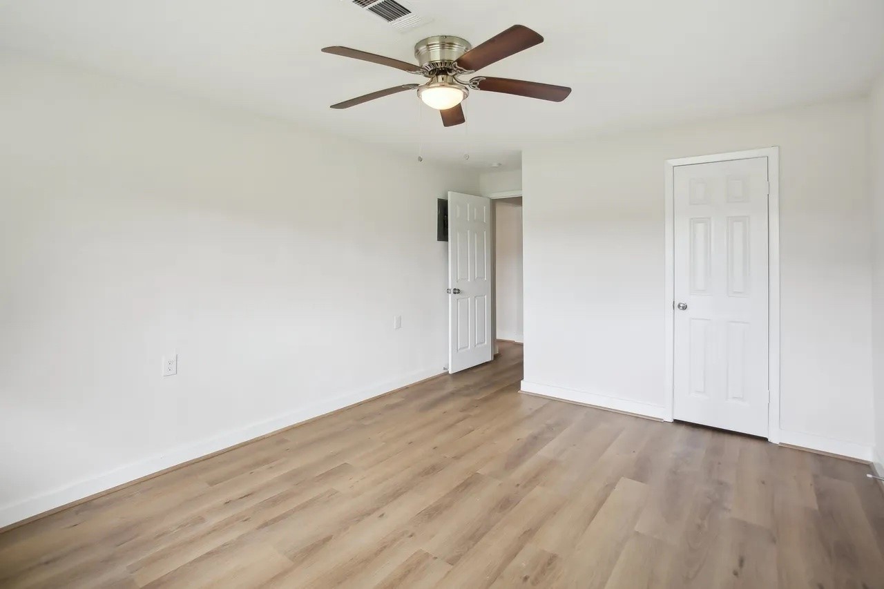 906 S Road Baytown, TX 77521 - Photo 14 of 32 wooden floor in an empty room
