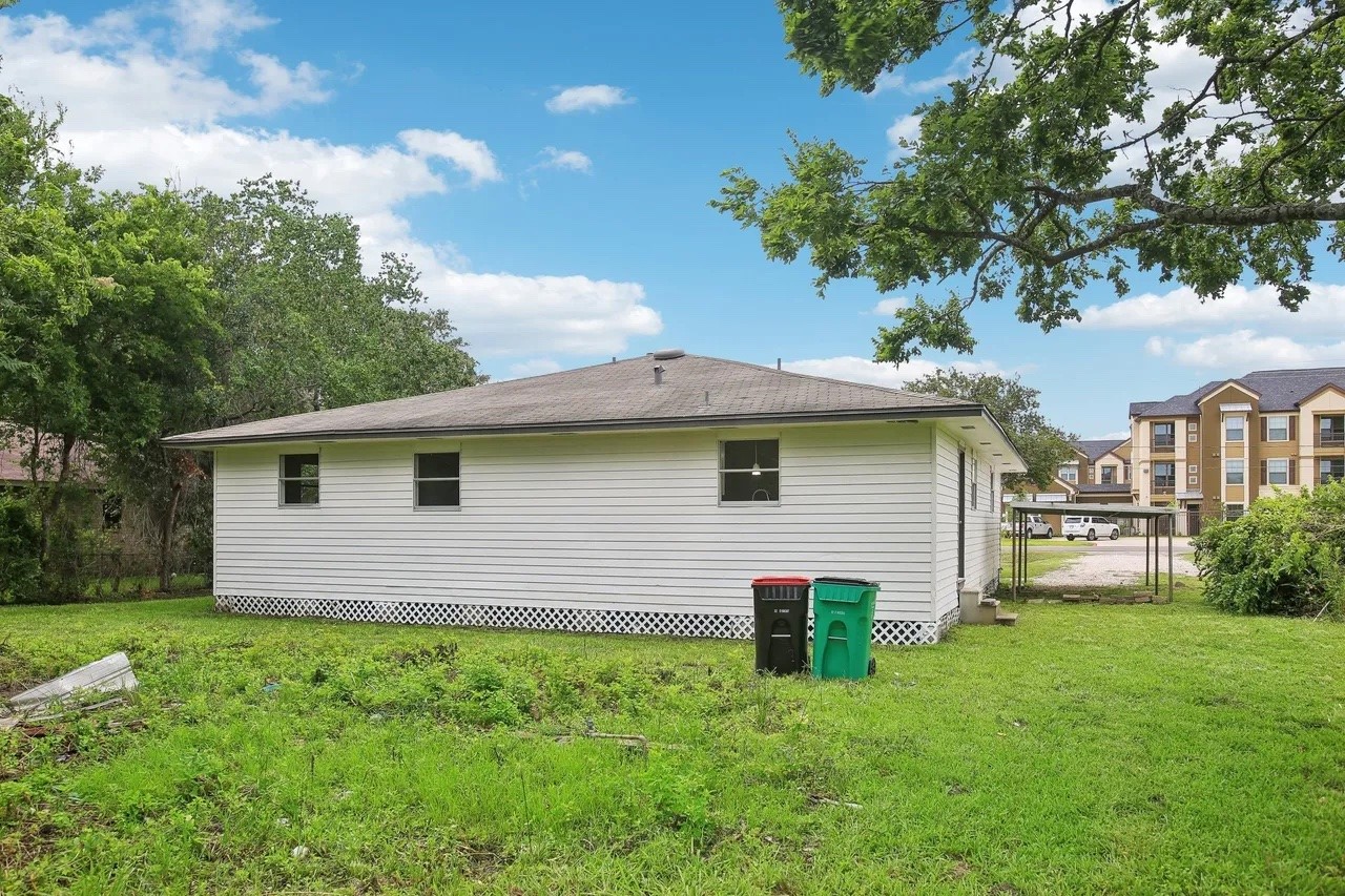 906 S Road Baytown, TX 77521 - Photo 20 of 32 a front view of house with yard and green space