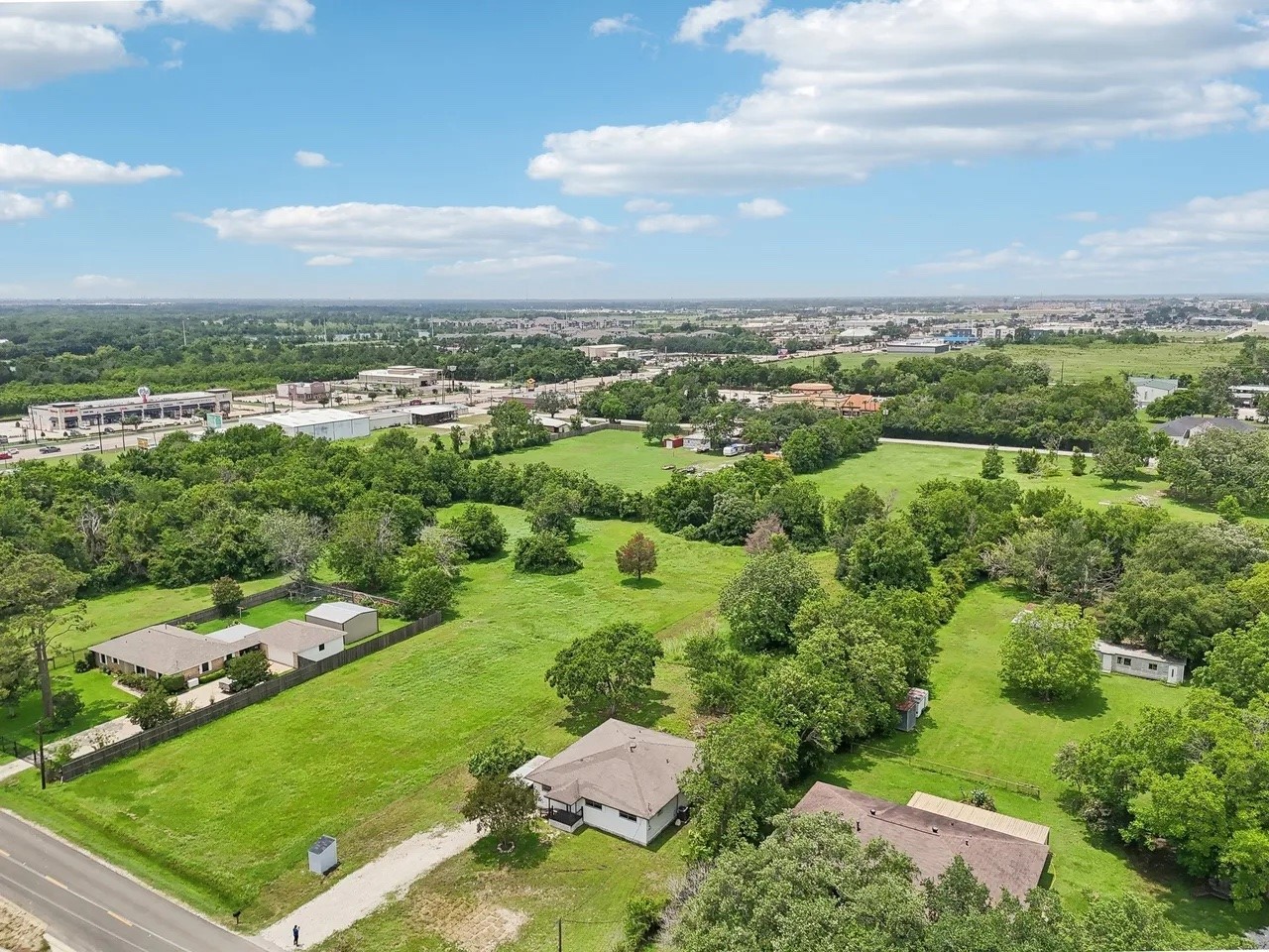 906 S Road Baytown, TX 77521 - Photo 24 of 32 an aerial view of residential houses with outdoor space and trees