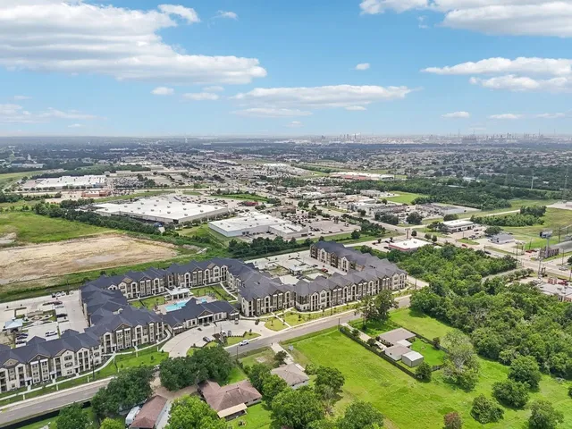 an aerial view of residential building and lake