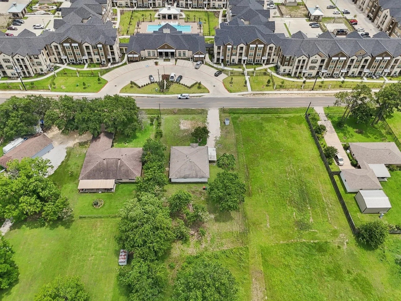 906 S Road Baytown, TX 77521 - Photo 30 of 32 an aerial view of residential houses with outdoor space and swimming pool