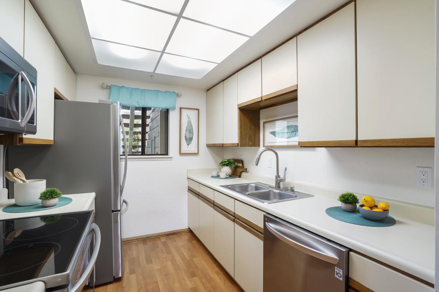 2601 Willowbrook Lane, Unit 9 Aptos, CA 95003 - Photo 14 of 29 a kitchen with a sink cabinets and stainless steel appliances