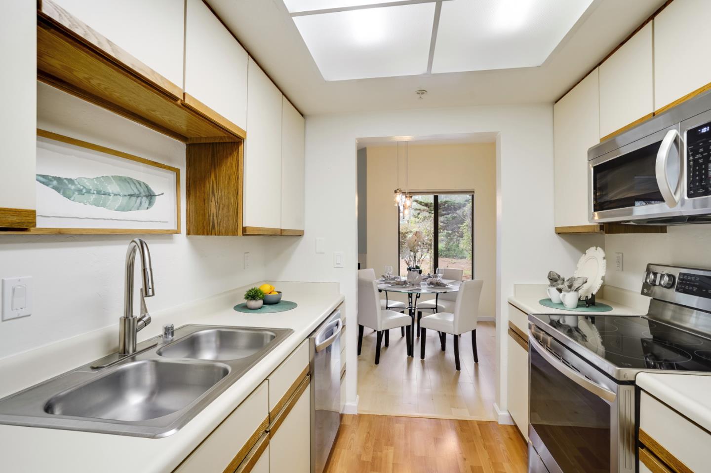 2601 Willowbrook Lane, Unit 9 Aptos, CA 95003 - Photo 15 of 29 a kitchen with stainless steel appliances granite countertop a sink a stove and cabinets
