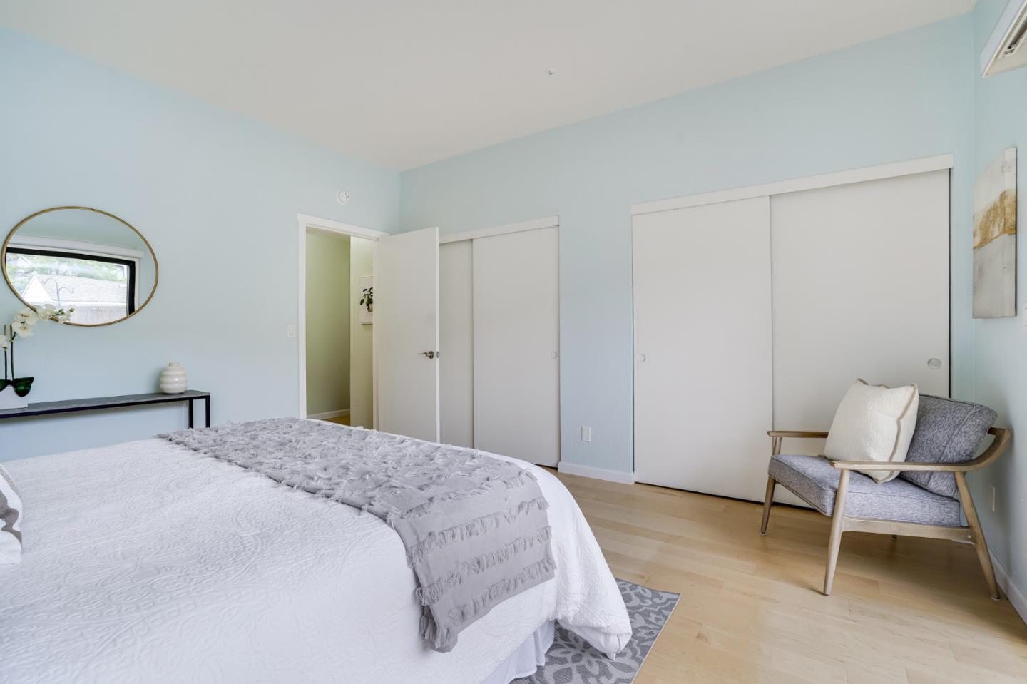 2601 Willowbrook Lane, Unit 9 Aptos, CA 95003 - Photo 24 of 29 a bedroom with a bed and a chair