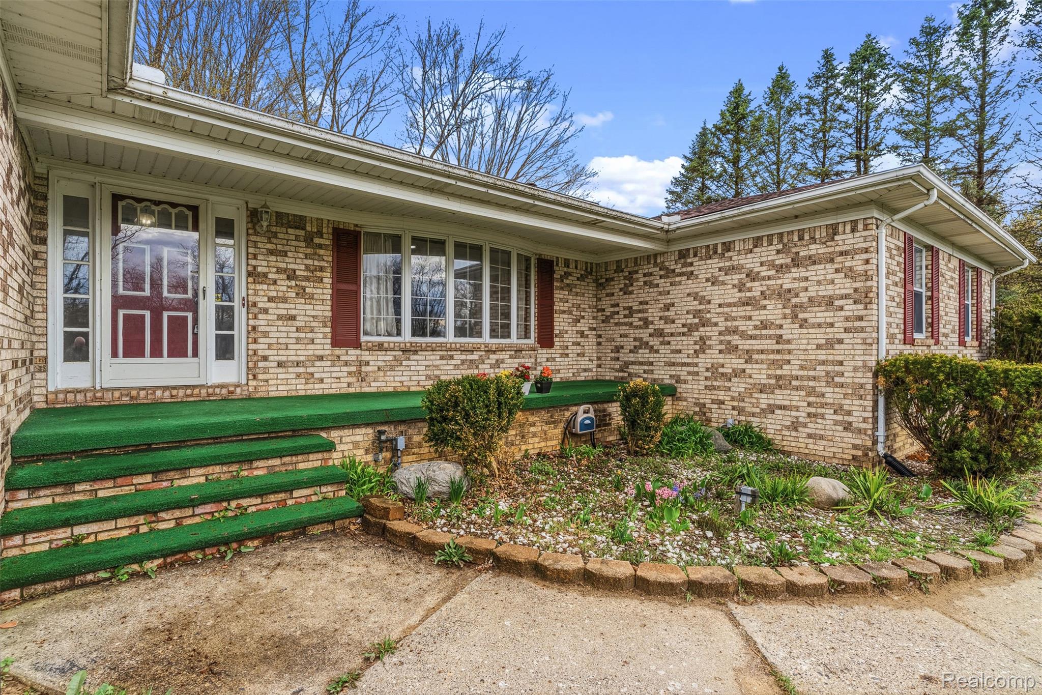 3432 South State Road Davison, MI 48423 - Photo 6 of 58 Property entrance with covered porch and brick siding