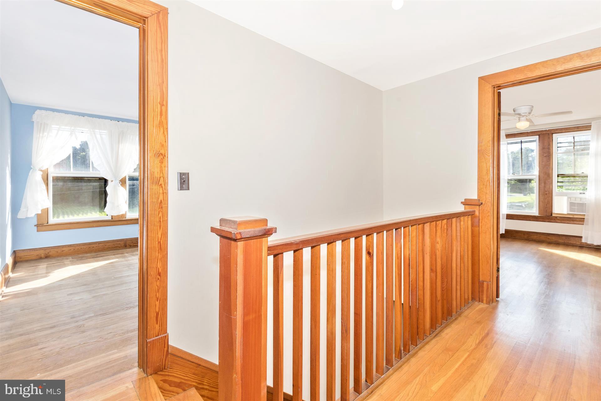 2601 Gillis Road Mount Airy, MD 21771 - Photo 18 of 29 a view of a hallway with wooden floor and windows