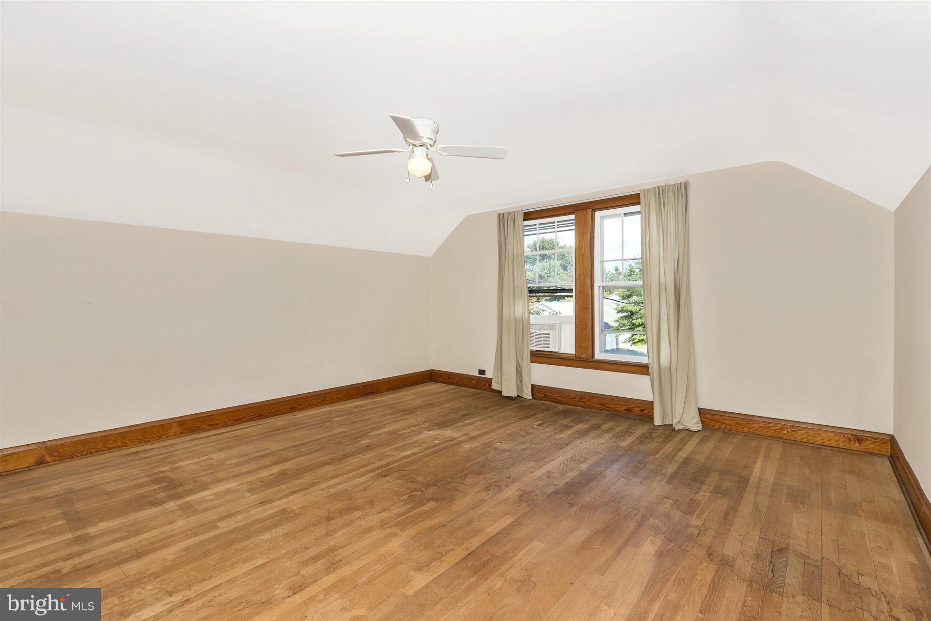 2601 Gillis Road Mount Airy, MD 21771 - Photo 19 of 29 a view of an empty room with wooden floor and a window