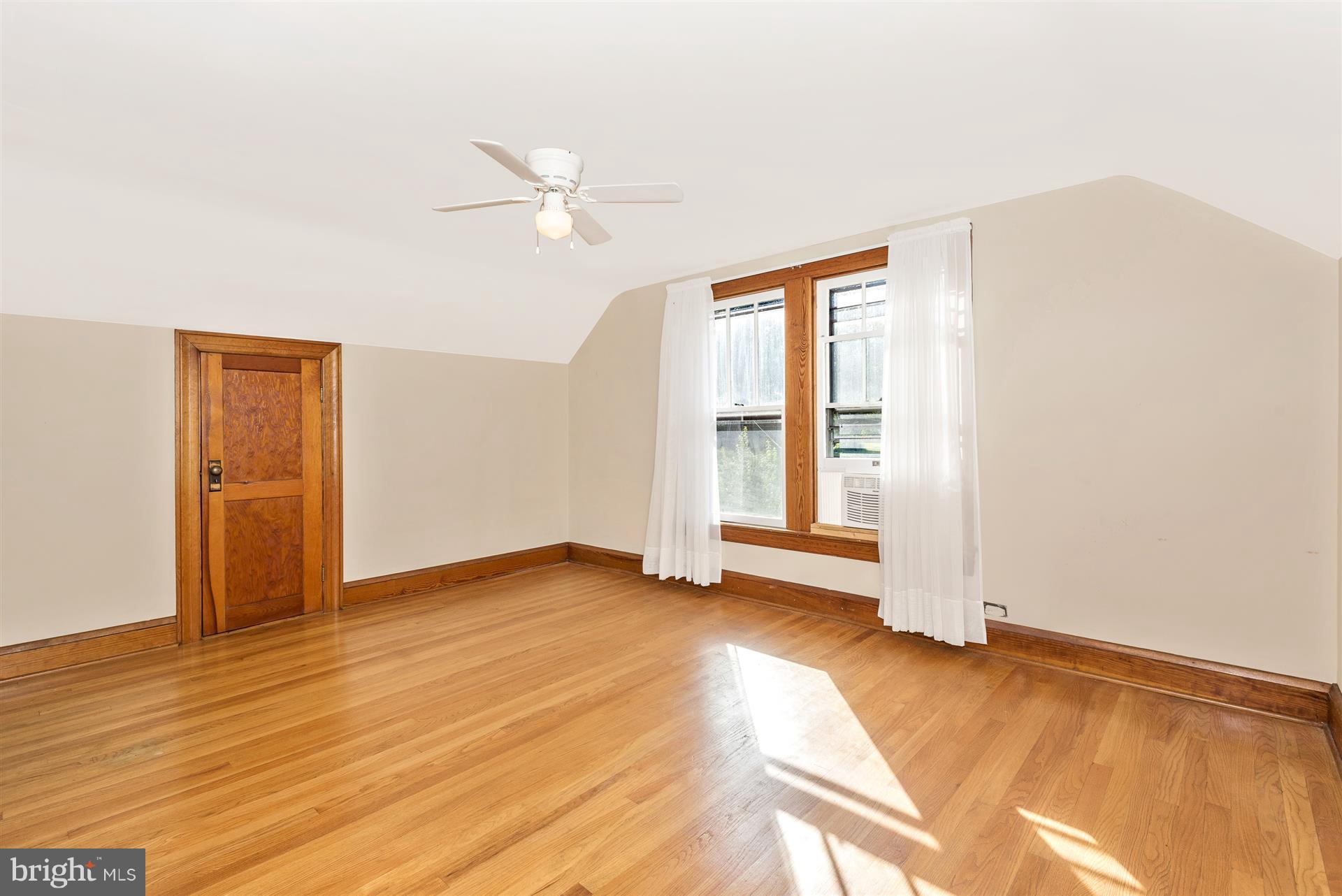 2601 Gillis Road Mount Airy, MD 21771 - Photo 22 of 29 a view of an empty room with wooden floor and a window