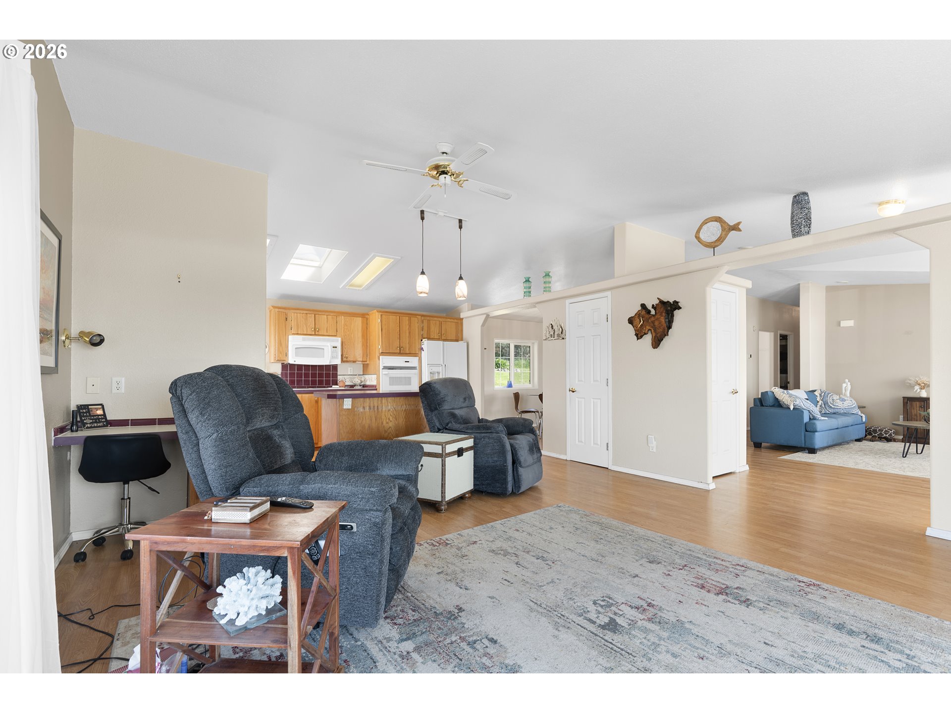 94033 Doyle Point Road Gold Beach, OR 97444 - Photo 11 of 42 a view of a livingroom with furniture window and wooden floor