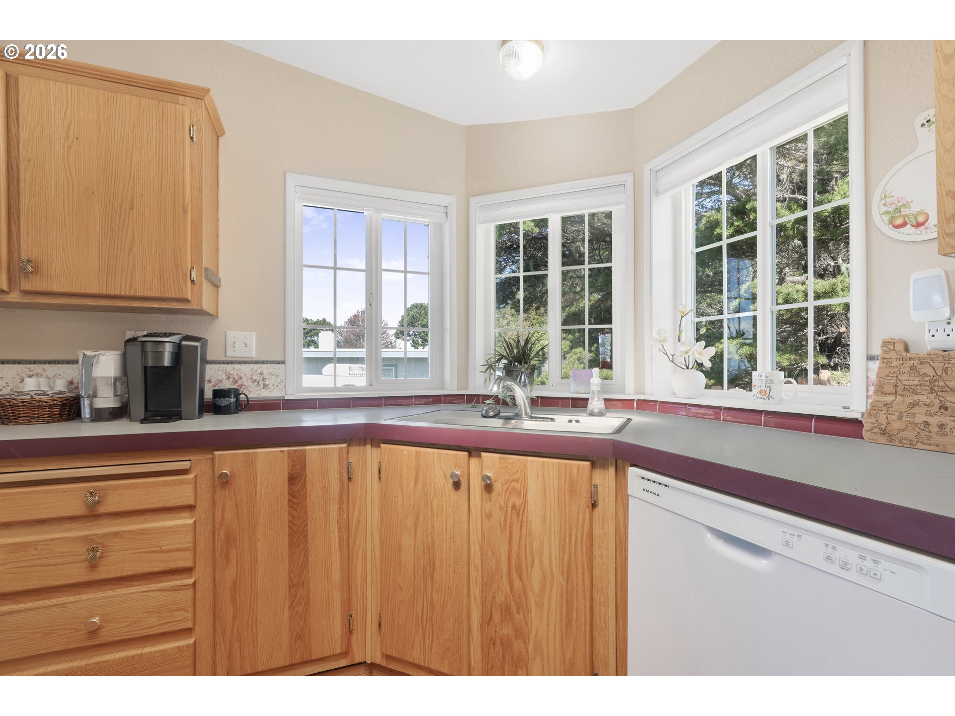 94033 Doyle Point Road Gold Beach, OR 97444 - Photo 13 of 42 a kitchen with a window a sink and a counter top space