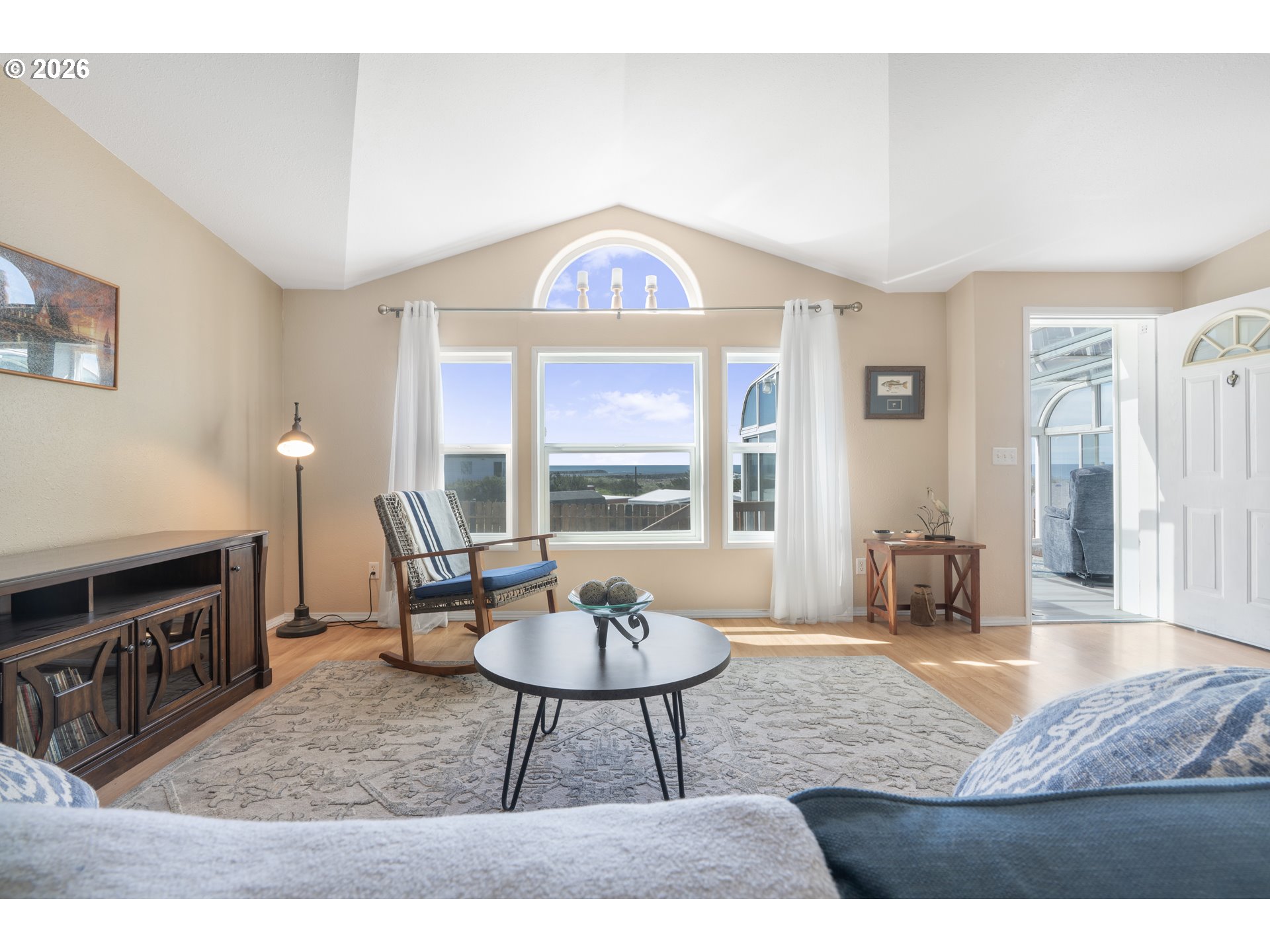 94033 Doyle Point Road Gold Beach, OR 97444 - Photo 17 of 42 a living room with furniture a window and a dining table