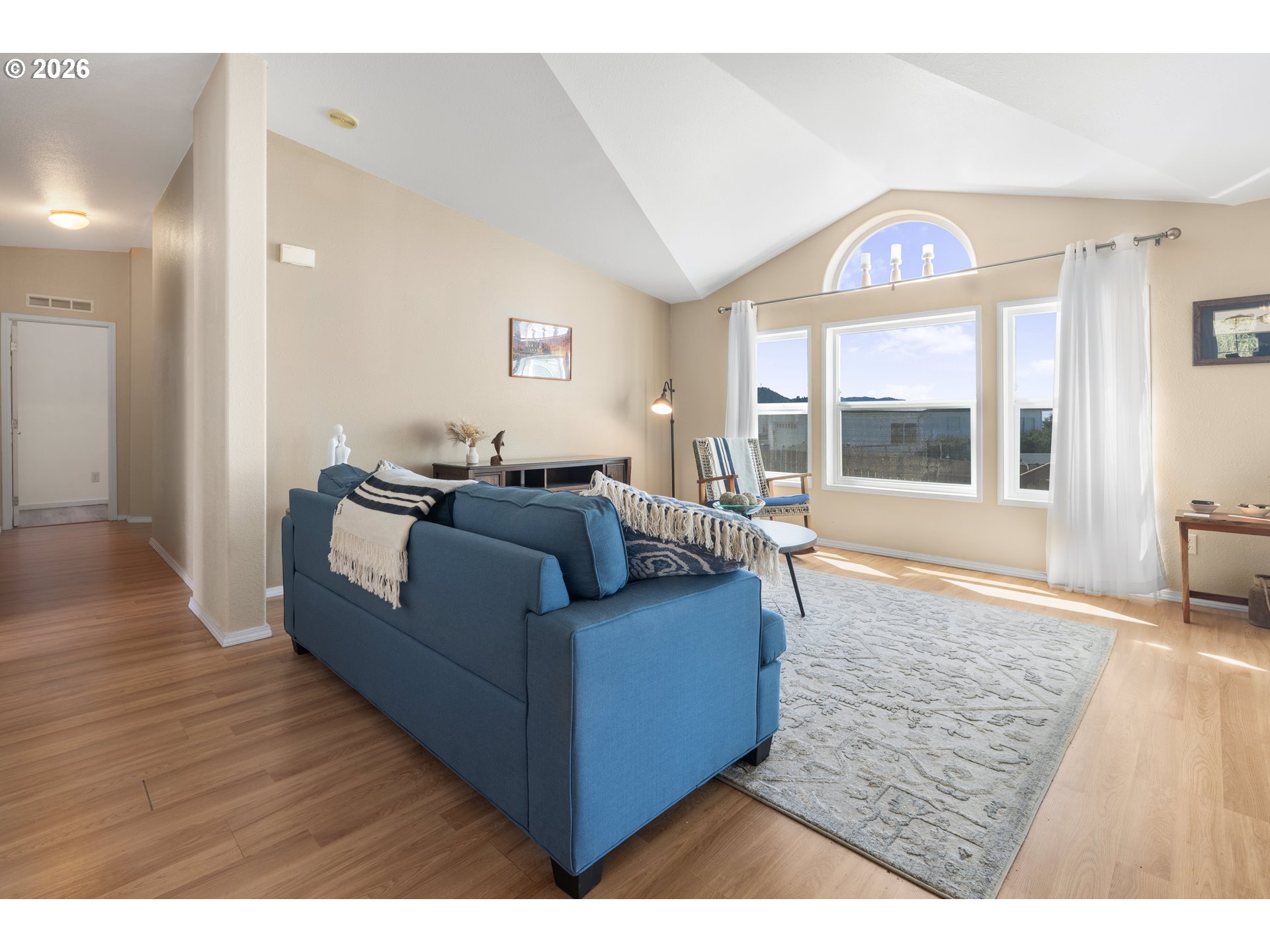 94033 Doyle Point Road Gold Beach, OR 97444 - Photo 18 of 42 a living room with furniture and a large window
