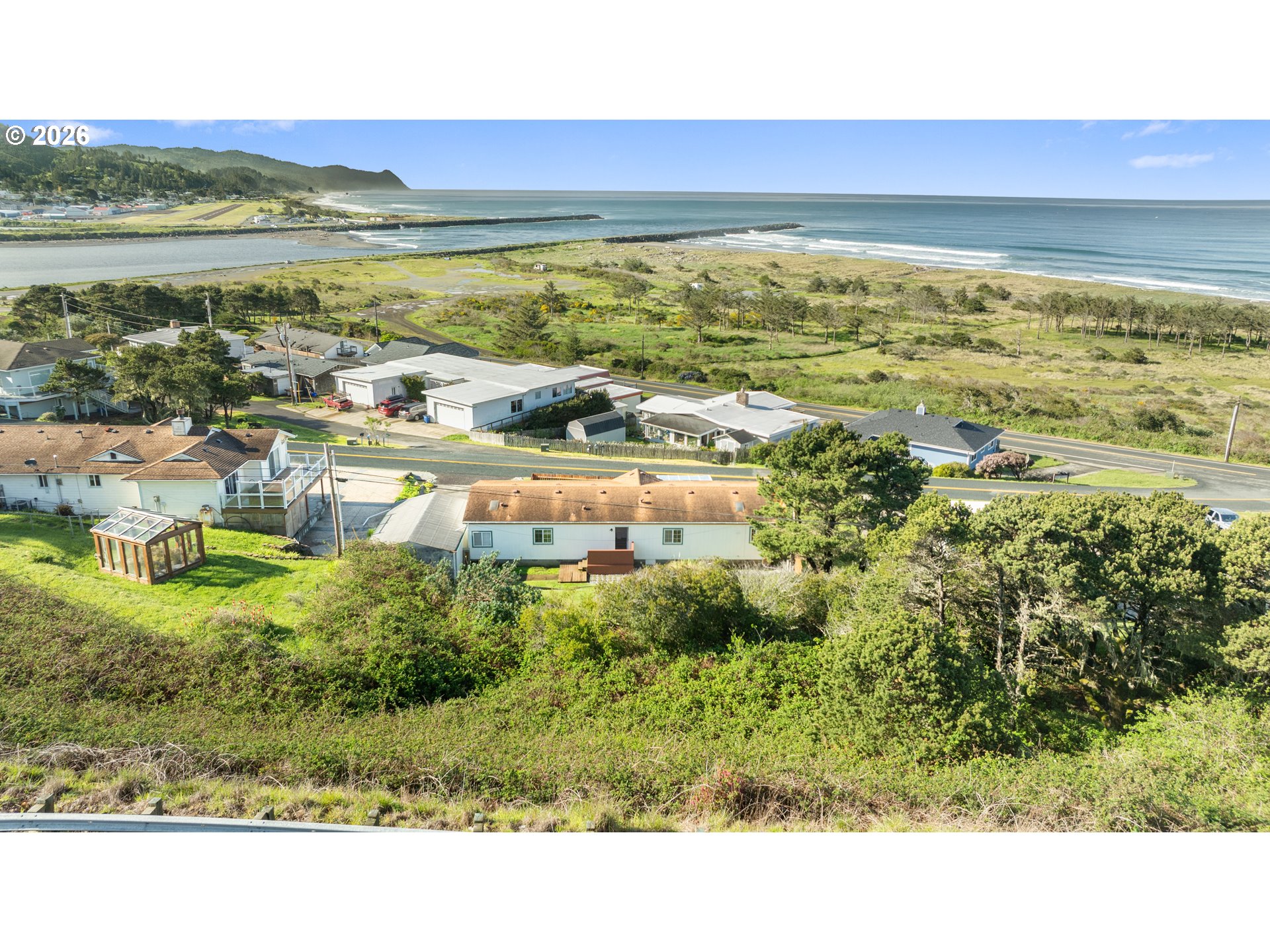94033 Doyle Point Road Gold Beach, OR 97444 - Photo 2 of 42 a picture of lake view and mountain view