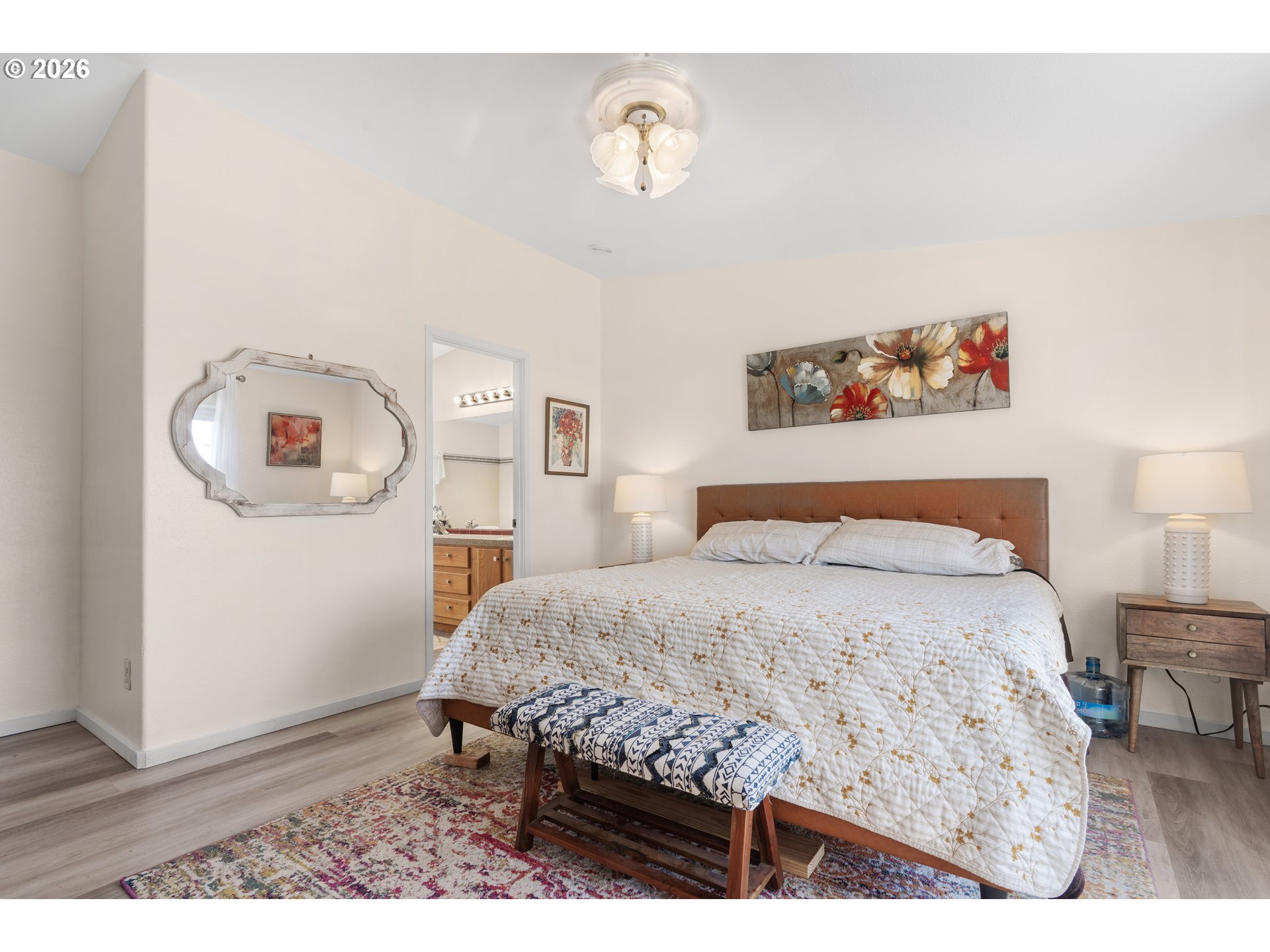 94033 Doyle Point Road Gold Beach, OR 97444 - Photo 21 of 42 a bedroom with a bed and a table in it