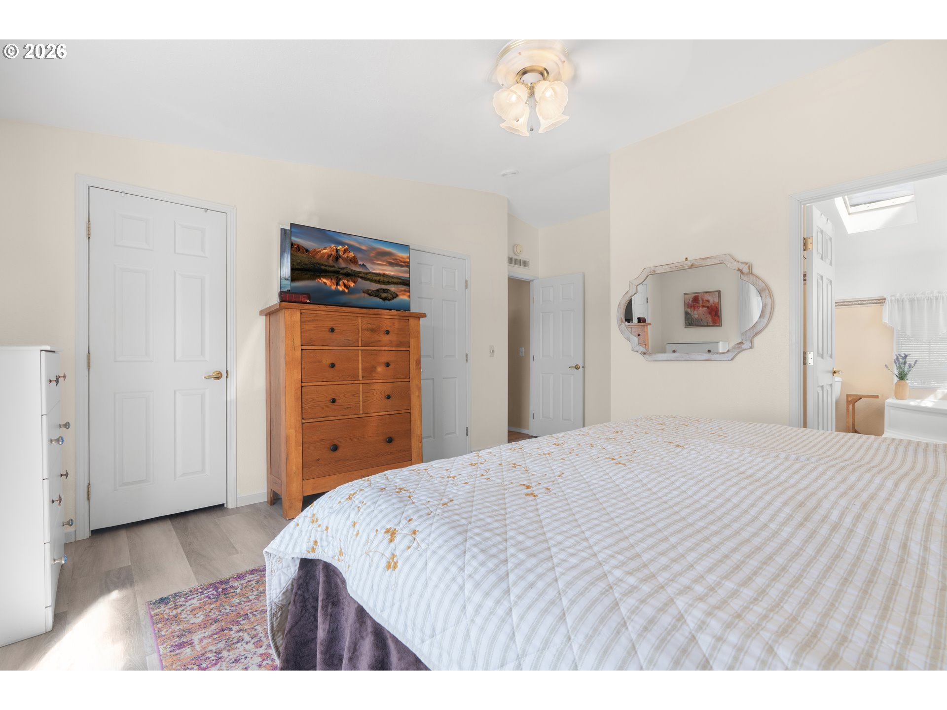 94033 Doyle Point Road Gold Beach, OR 97444 - Photo 23 of 42 a bedroom with a bed and a mirror