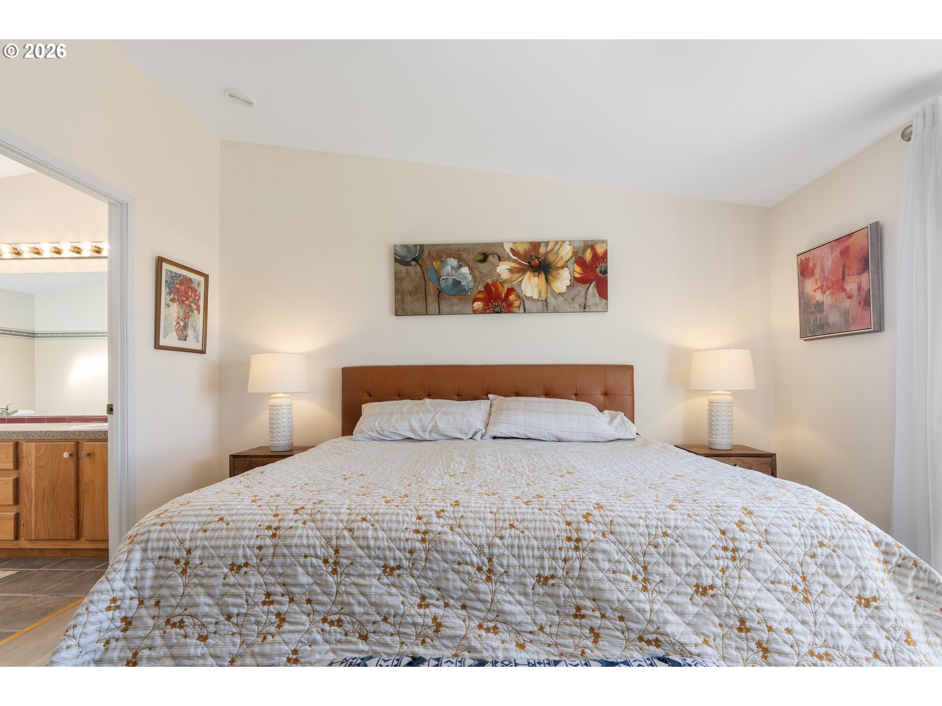 94033 Doyle Point Road Gold Beach, OR 97444 - Photo 24 of 42 a bedroom with a bed and a painting on the wall