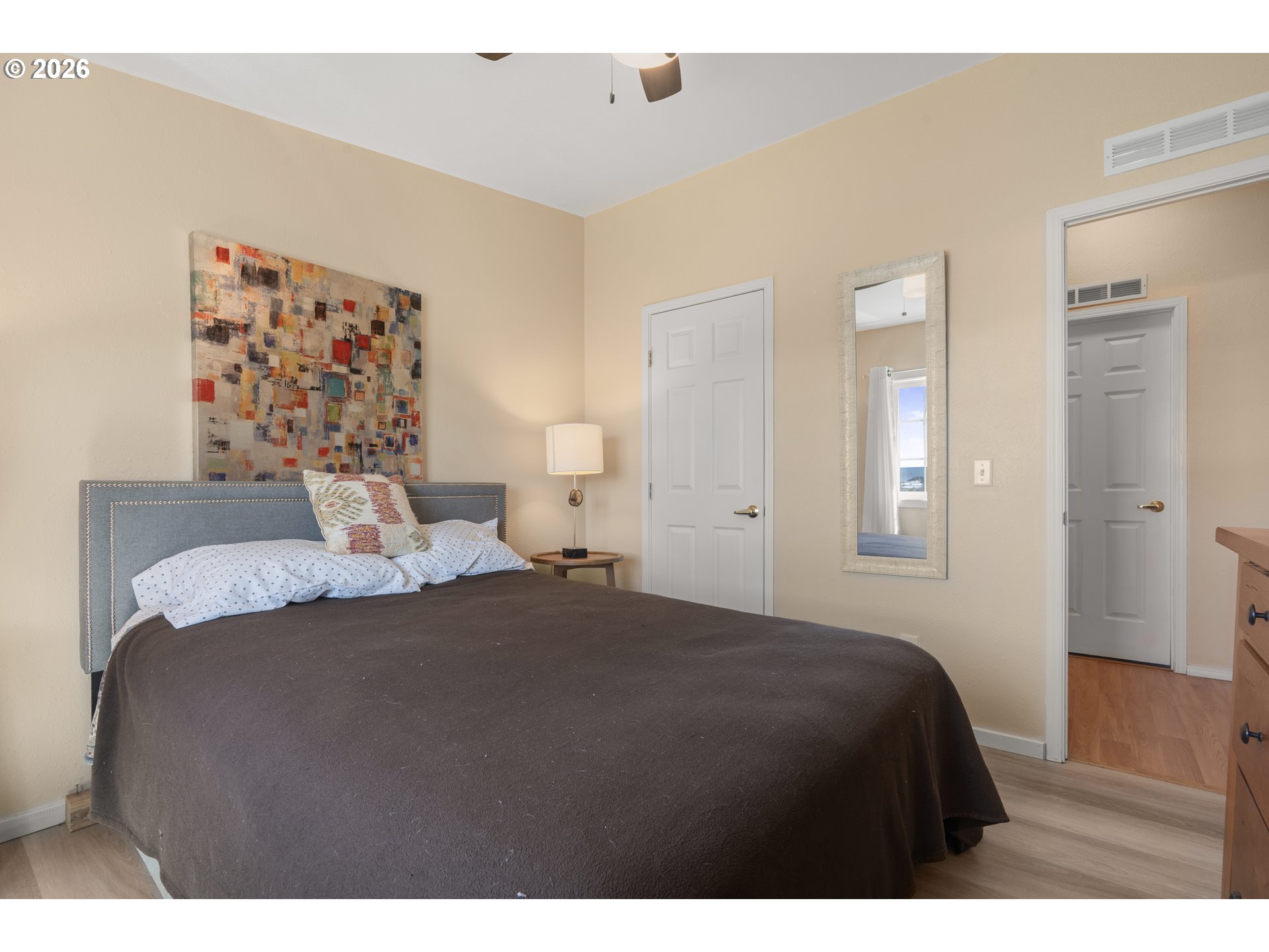 94033 Doyle Point Road Gold Beach, OR 97444 - Photo 29 of 42 a bedroom with a bed and a painting
