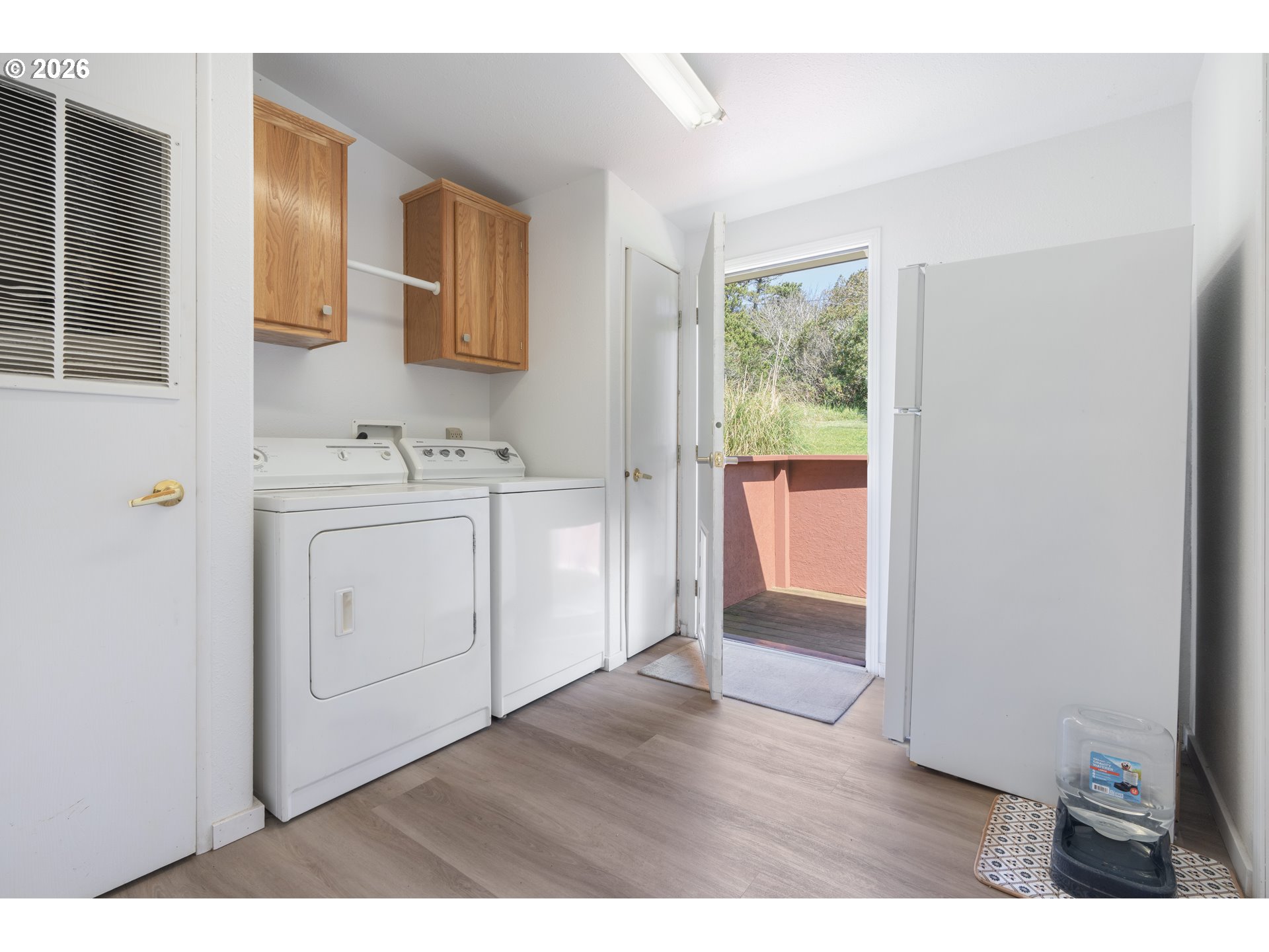 94033 Doyle Point Road Gold Beach, OR 97444 - Photo 33 of 42 a view of a kitchen with wooden floor and electronic appliances
