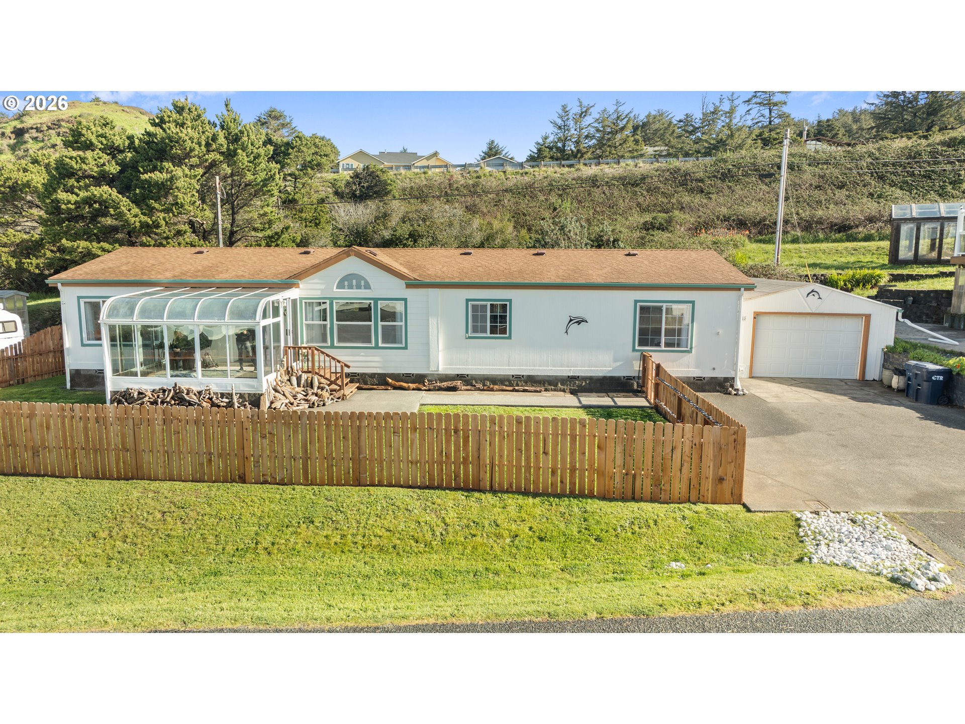 94033 Doyle Point Road Gold Beach, OR 97444 - Photo 37 of 42 a view of a house with a backyard
