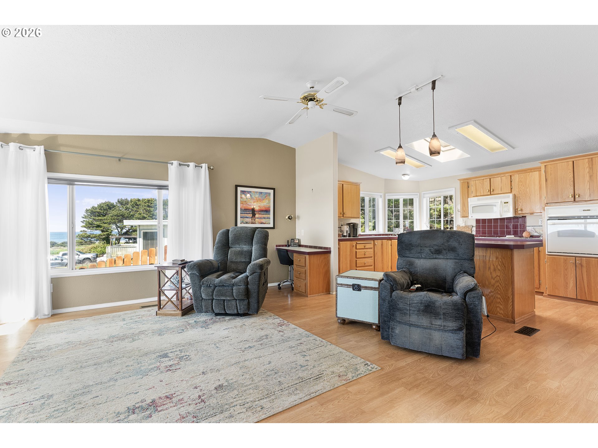 94033 Doyle Point Road Gold Beach, OR 97444 - Photo 7 of 42 a living room with furniture and a large window
