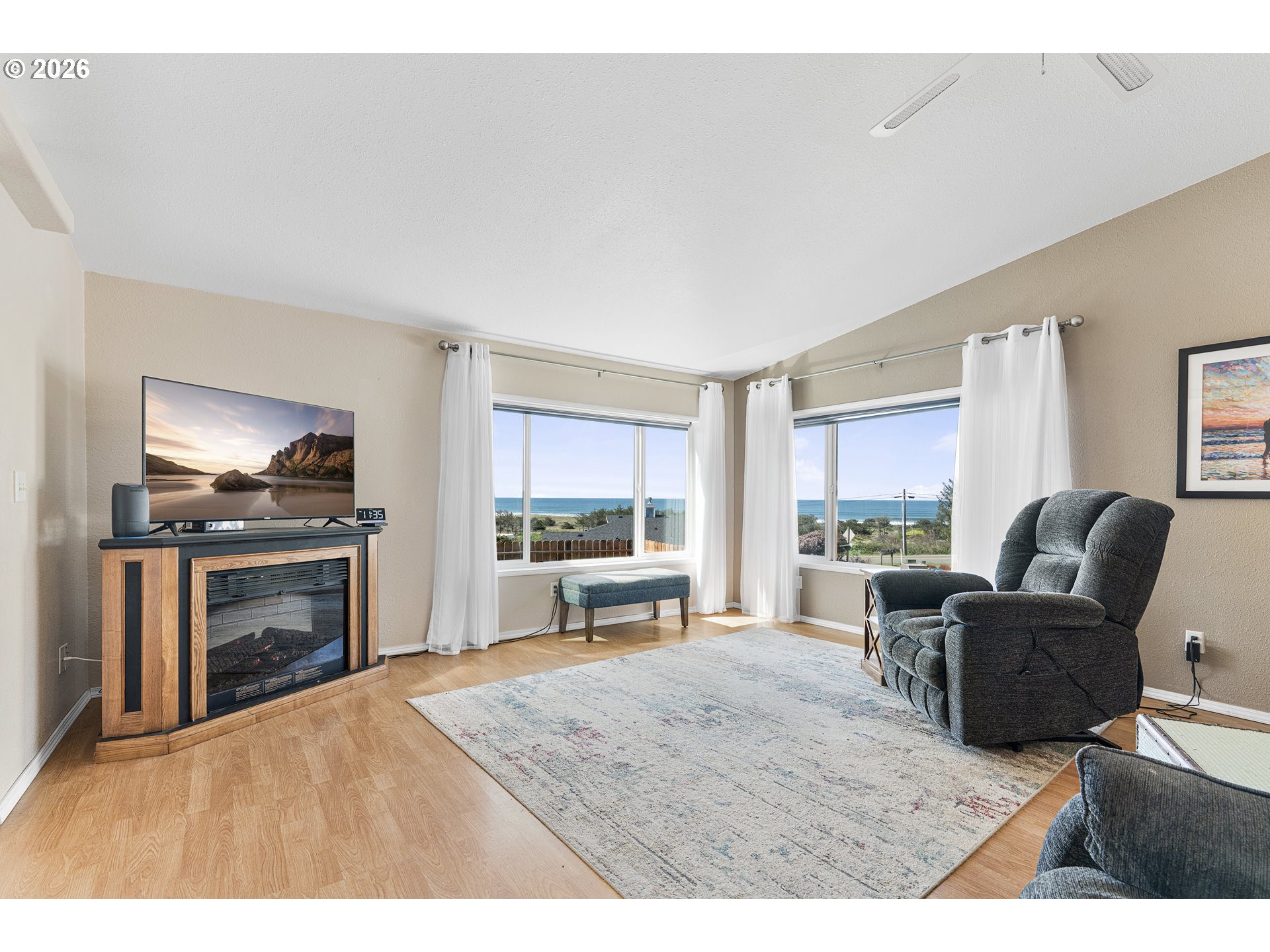 94033 Doyle Point Road Gold Beach, OR 97444 - Photo 8 of 42 a living room with furniture and a flat screen tv