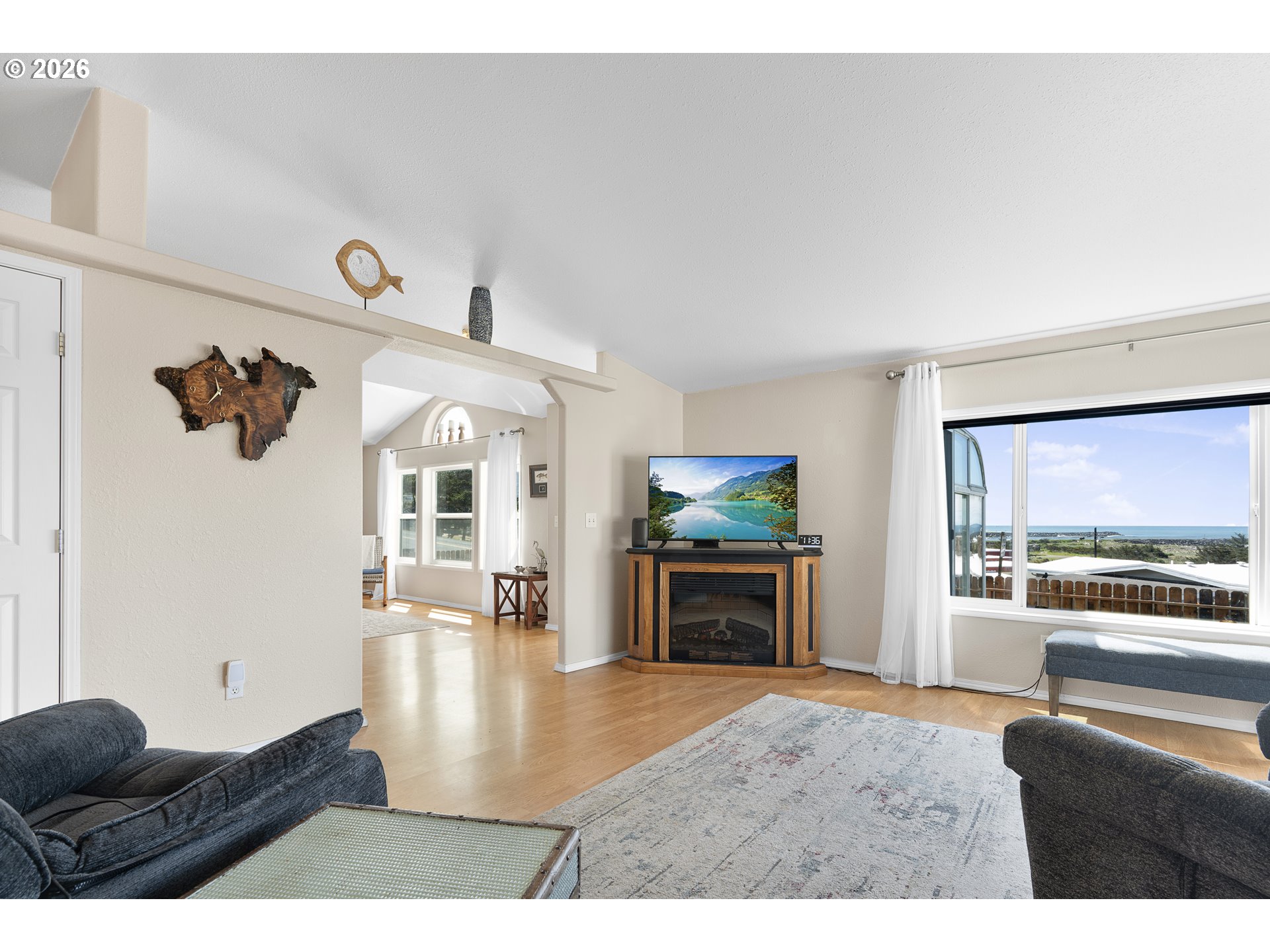 94033 Doyle Point Road Gold Beach, OR 97444 - Photo 10 of 42 a living room with furniture and a flat screen tv