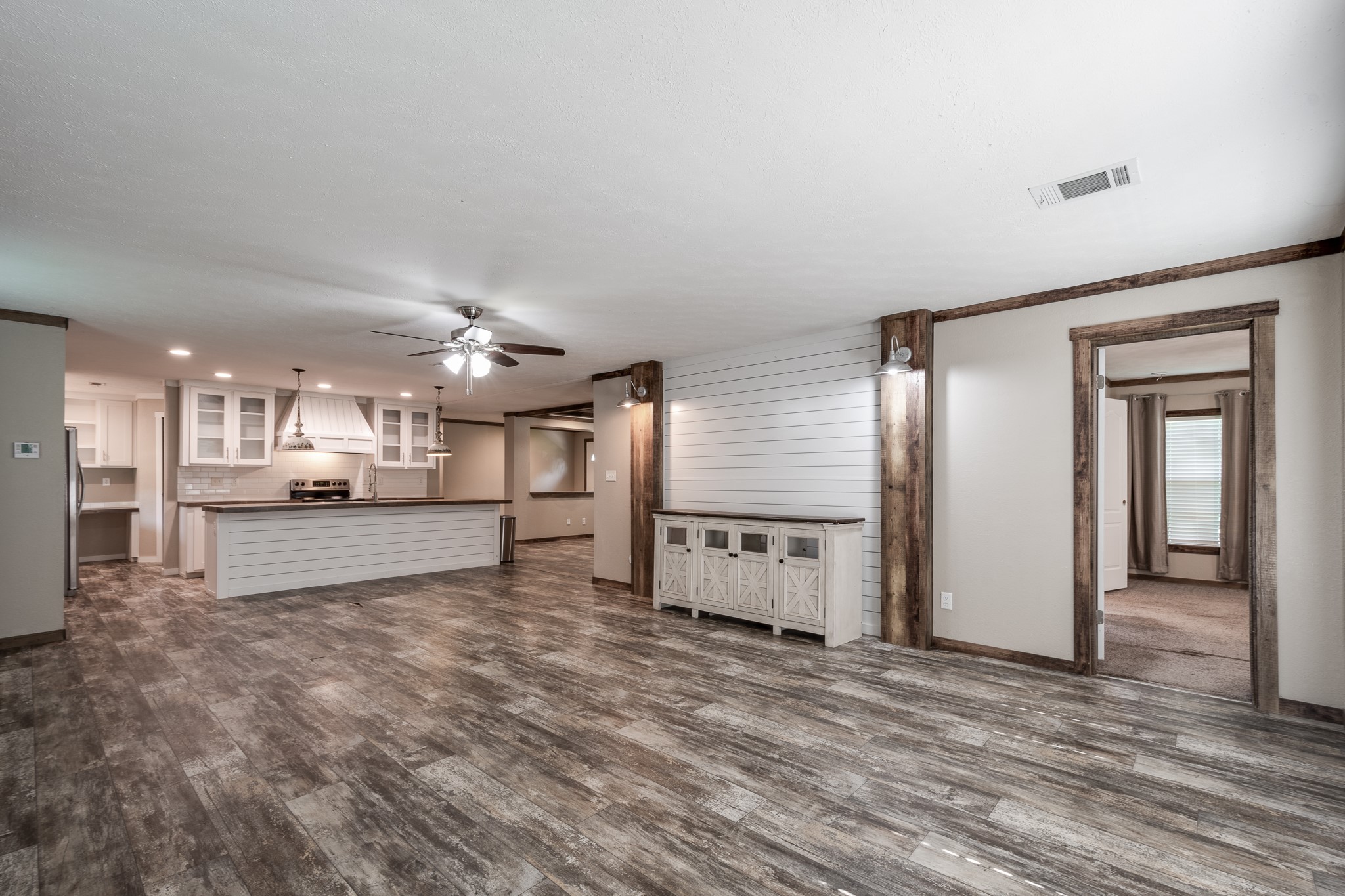 1713 Fm 2797 Dayton, TX 77535 - Photo 12 of 50 a large white kitchen with a refrigerator a stove and a sink