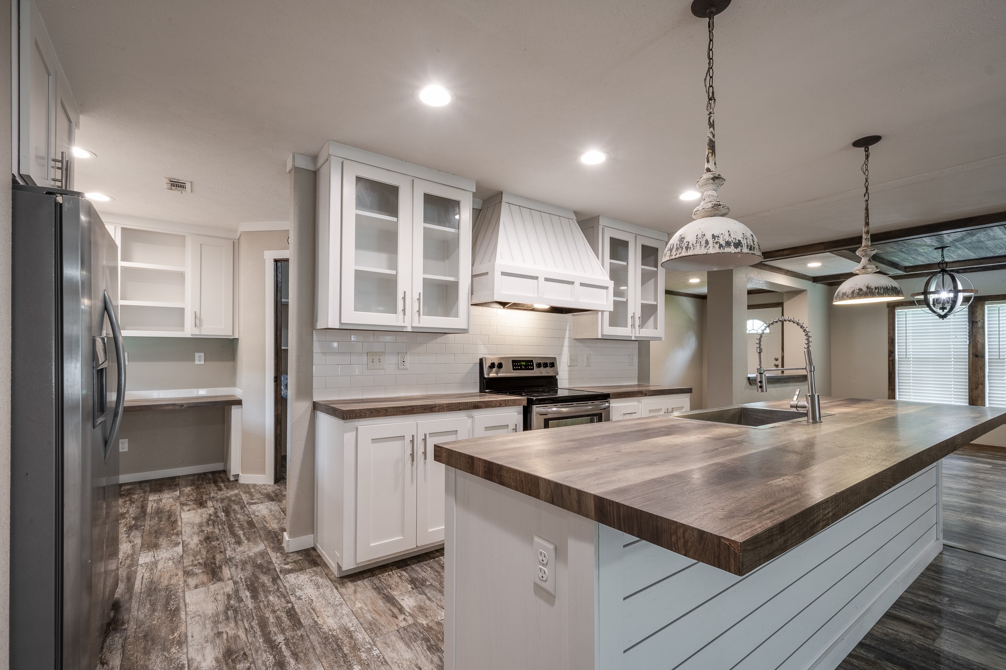 1713 Fm 2797 Dayton, TX 77535 - Photo 14 of 50 a kitchen with kitchen island a counter top space a sink stainless steel appliances and cabinets