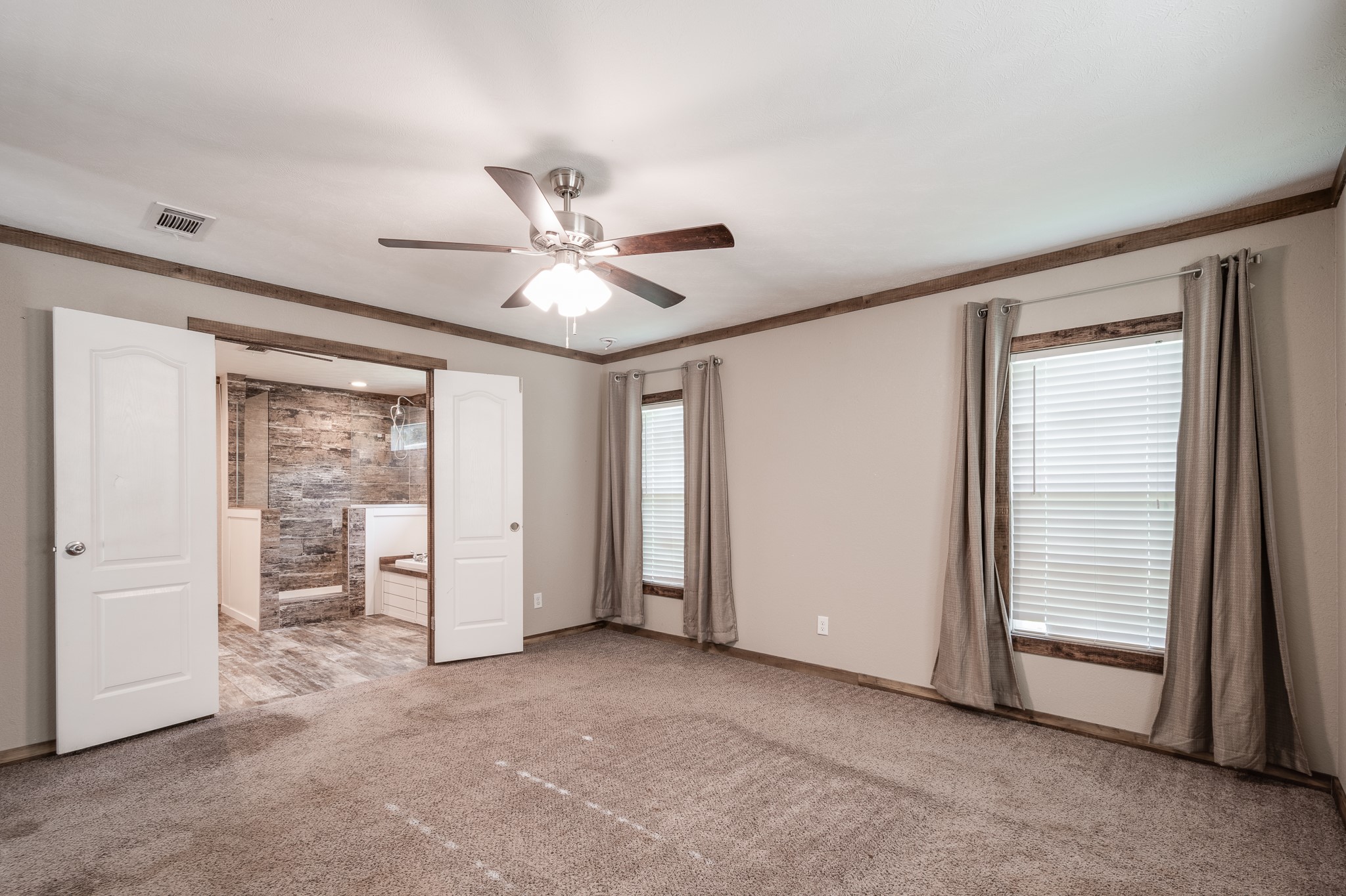 1713 Fm 2797 Dayton, TX 77535 - Photo 18 of 50 an empty room with fan and windows