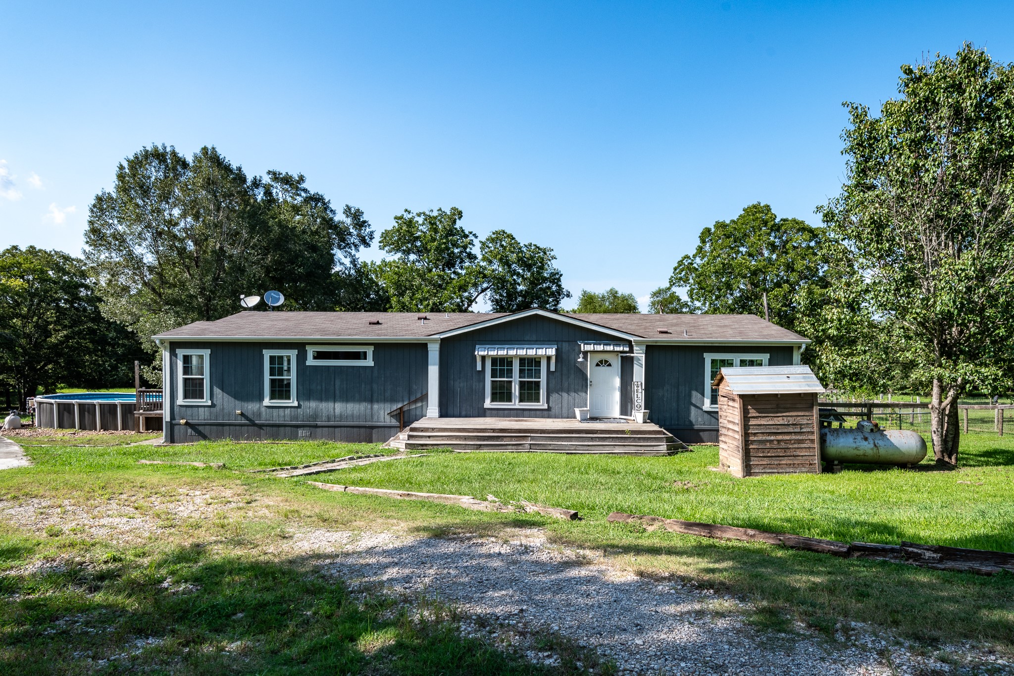 1713 Fm 2797 Dayton, TX 77535 - Photo 2 of 50 a view of a house with a yard and sitting area