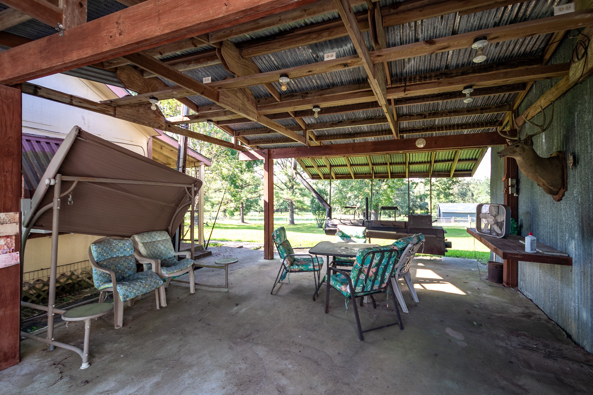 1713 Fm 2797 Dayton, TX 77535 - Photo 43 of 50 a view of a patio with table and chairs and potted plants