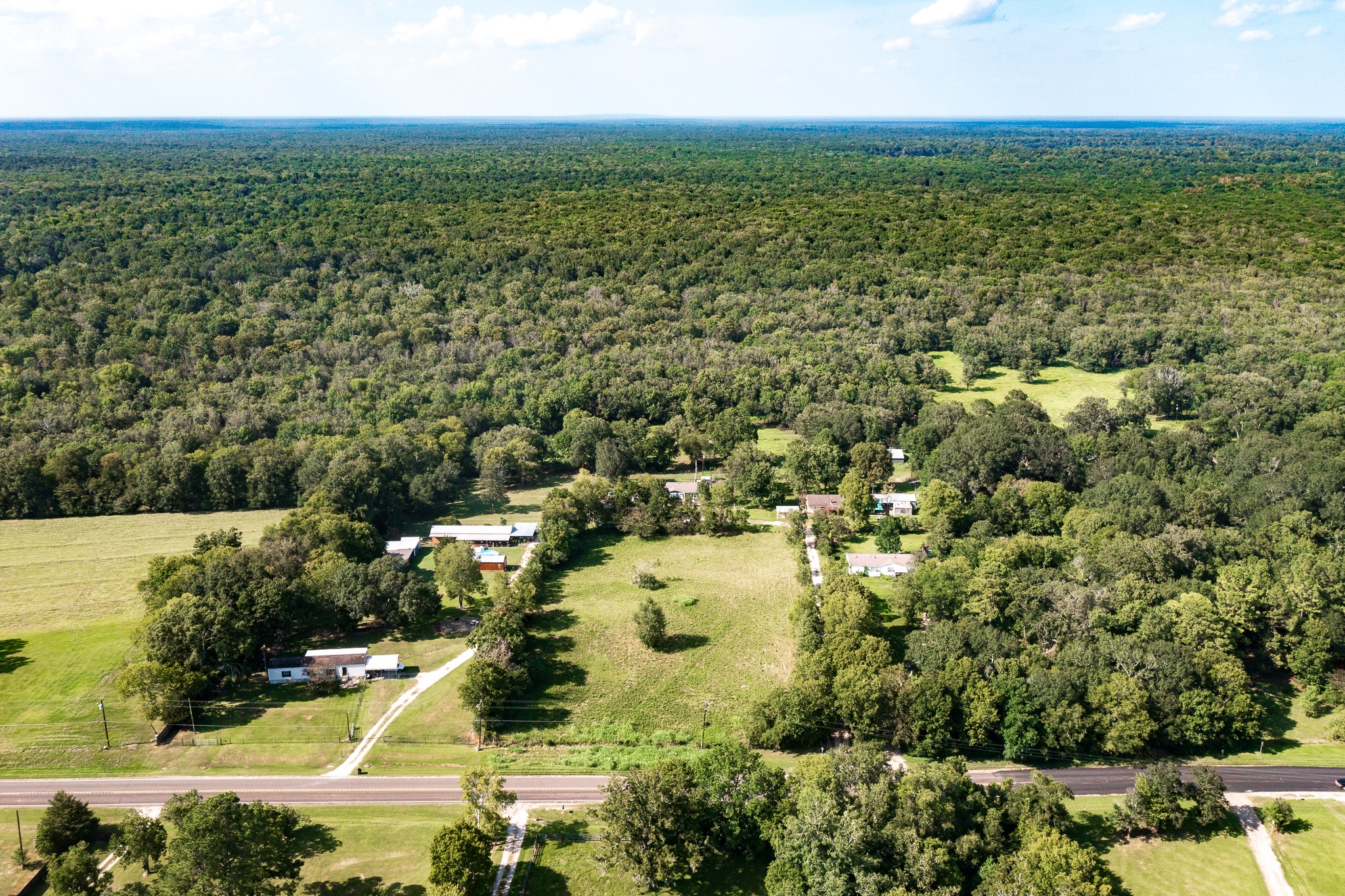 1713 Fm 2797 Dayton, TX 77535 - Photo 50 of 50 an aerial view of residential houses with outdoor space and trees