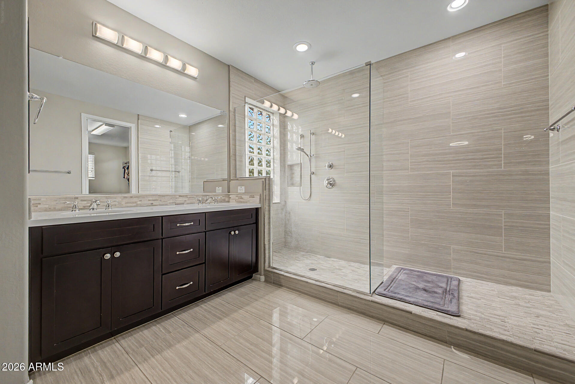 15918 South 11th Way Phoenix, AZ 85048 - Photo 14 of 32 a spacious bathroom with a granite countertop sink mirror and shower