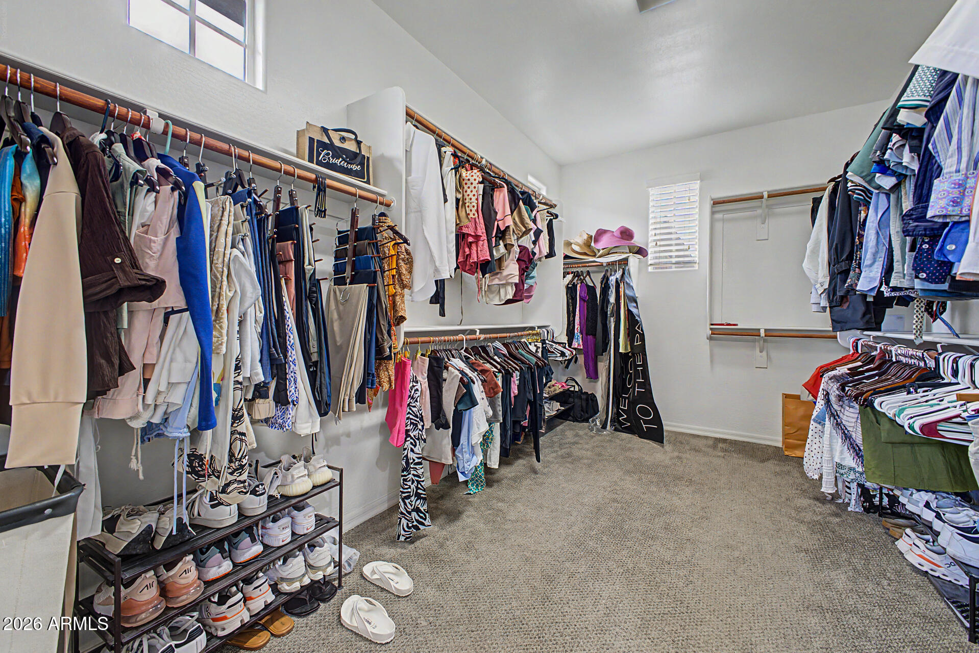15918 South 11th Way Phoenix, AZ 85048 - Photo 15 of 32 a view of walk in closet with clothes