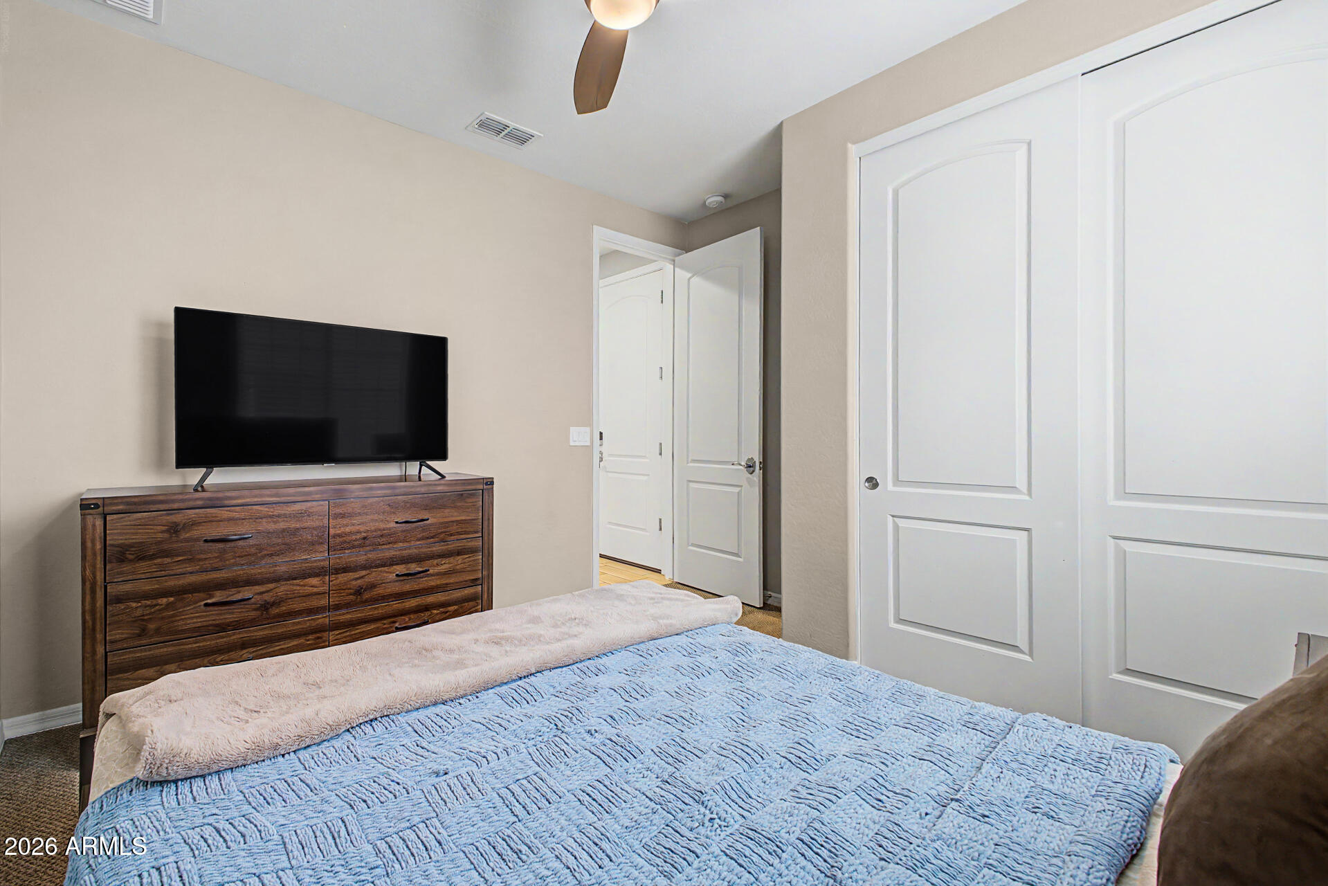 15918 South 11th Way Phoenix, AZ 85048 - Photo 22 of 32 a living room with flat screen tv and a couch