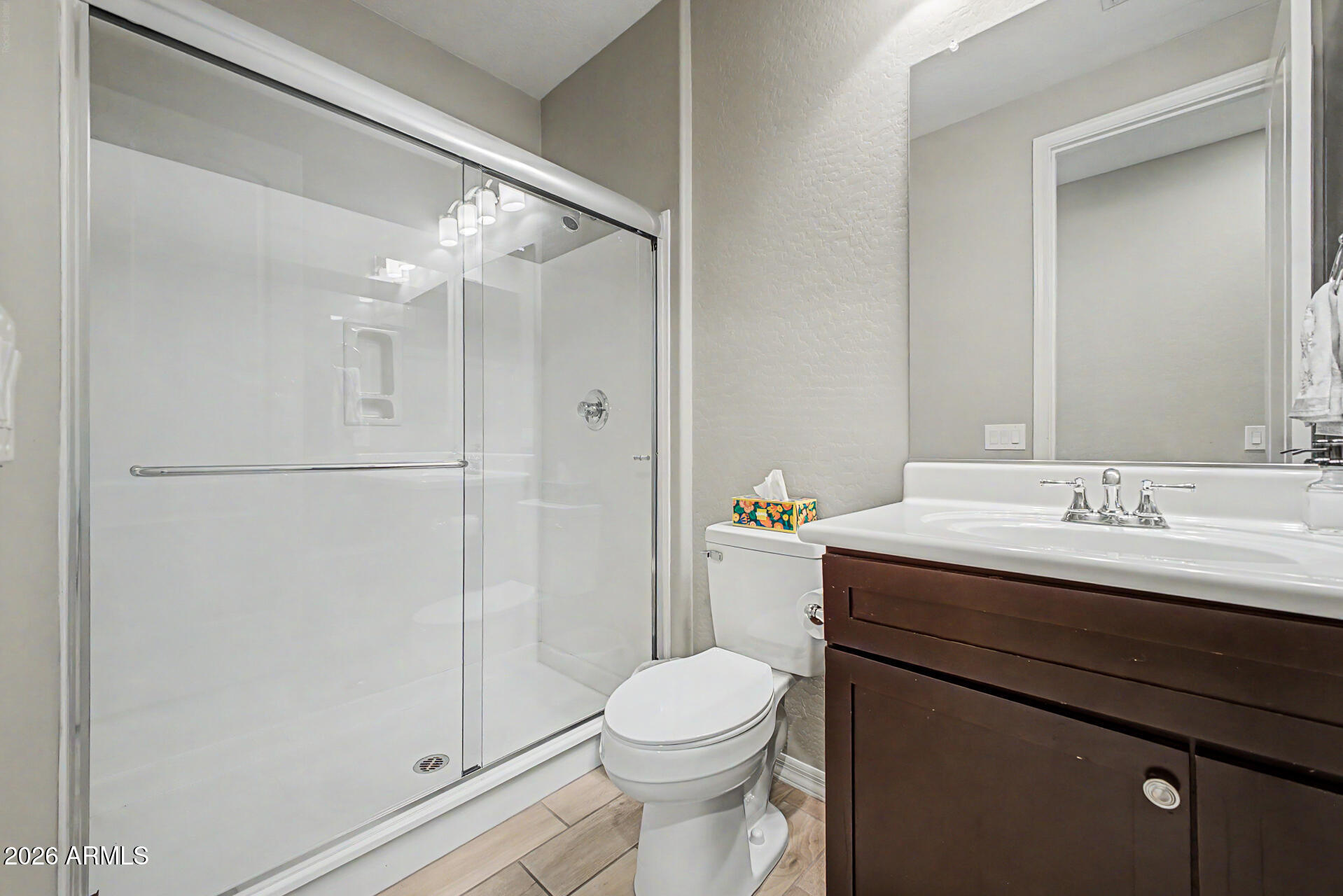 15918 South 11th Way Phoenix, AZ 85048 - Photo 23 of 32 a bathroom with a sink a toilet and shower