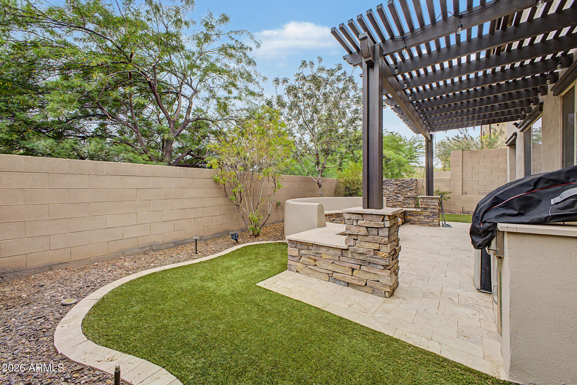 15918 South 11th Way Phoenix, AZ 85048 - Photo 30 of 32 a view of a patio with table and chairs with wooden floor and fence
