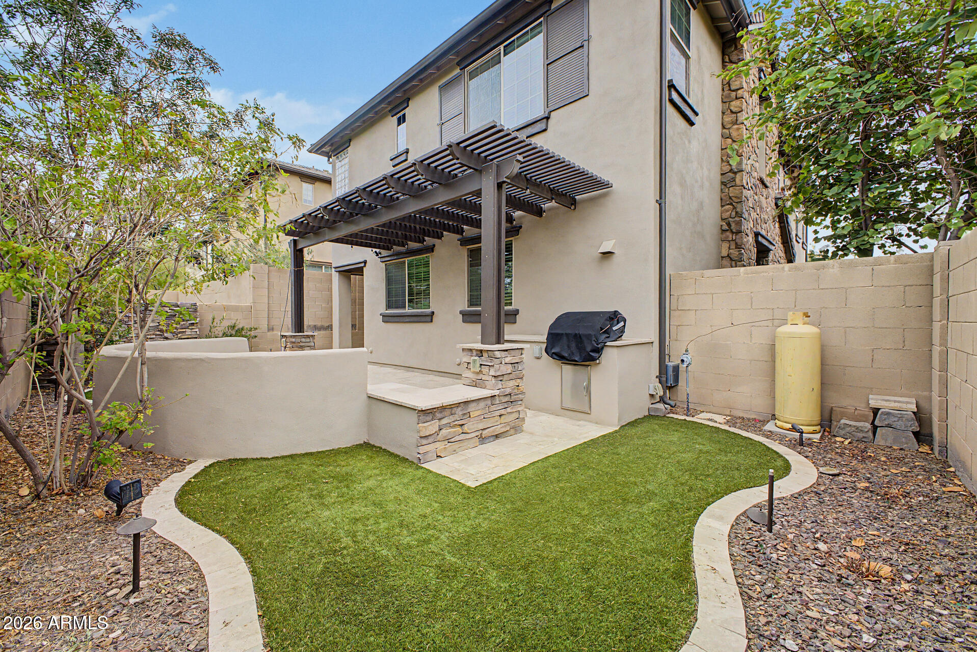 15918 South 11th Way Phoenix, AZ 85048 - Photo 31 of 32 a view of a patio with couches chairs and a fire pit