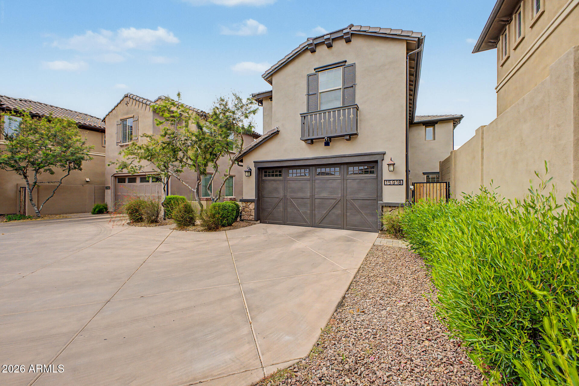 15918 South 11th Way Phoenix, AZ 85048 - Photo 32 of 32 a front view of a house with a yard and garage