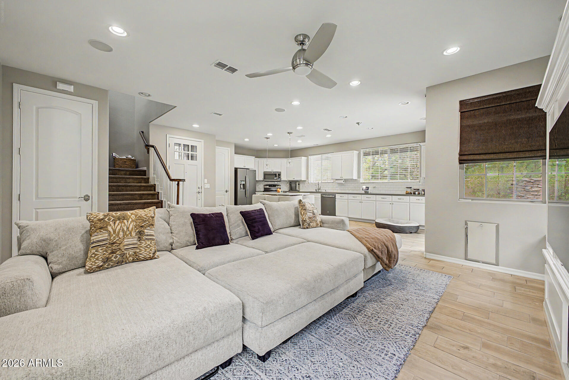 15918 South 11th Way Phoenix, AZ 85048 - Photo 4 of 32 a bedroom with a large bed and a flat tv screen on dresser