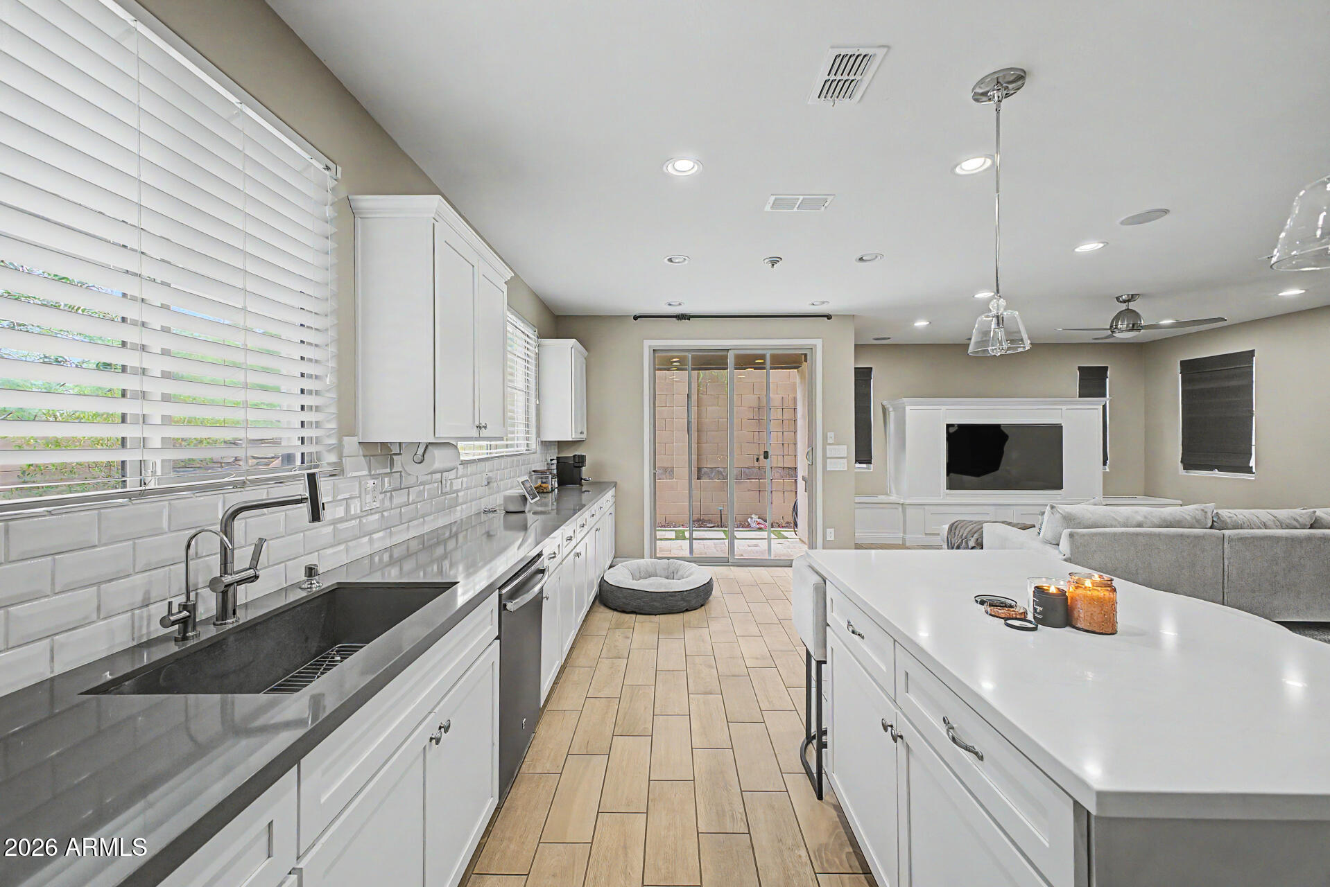 15918 South 11th Way Phoenix, AZ 85048 - Photo 10 of 32 a large white kitchen with a large island