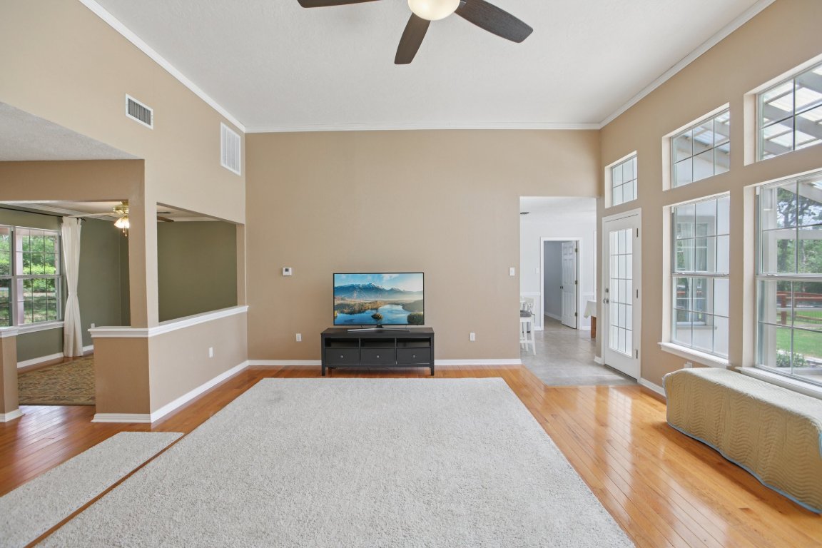 148 Oak Ridge Drive Cedar Creek, TX 78612 - Photo 13 of 40 a bedroom with furniture and a large window